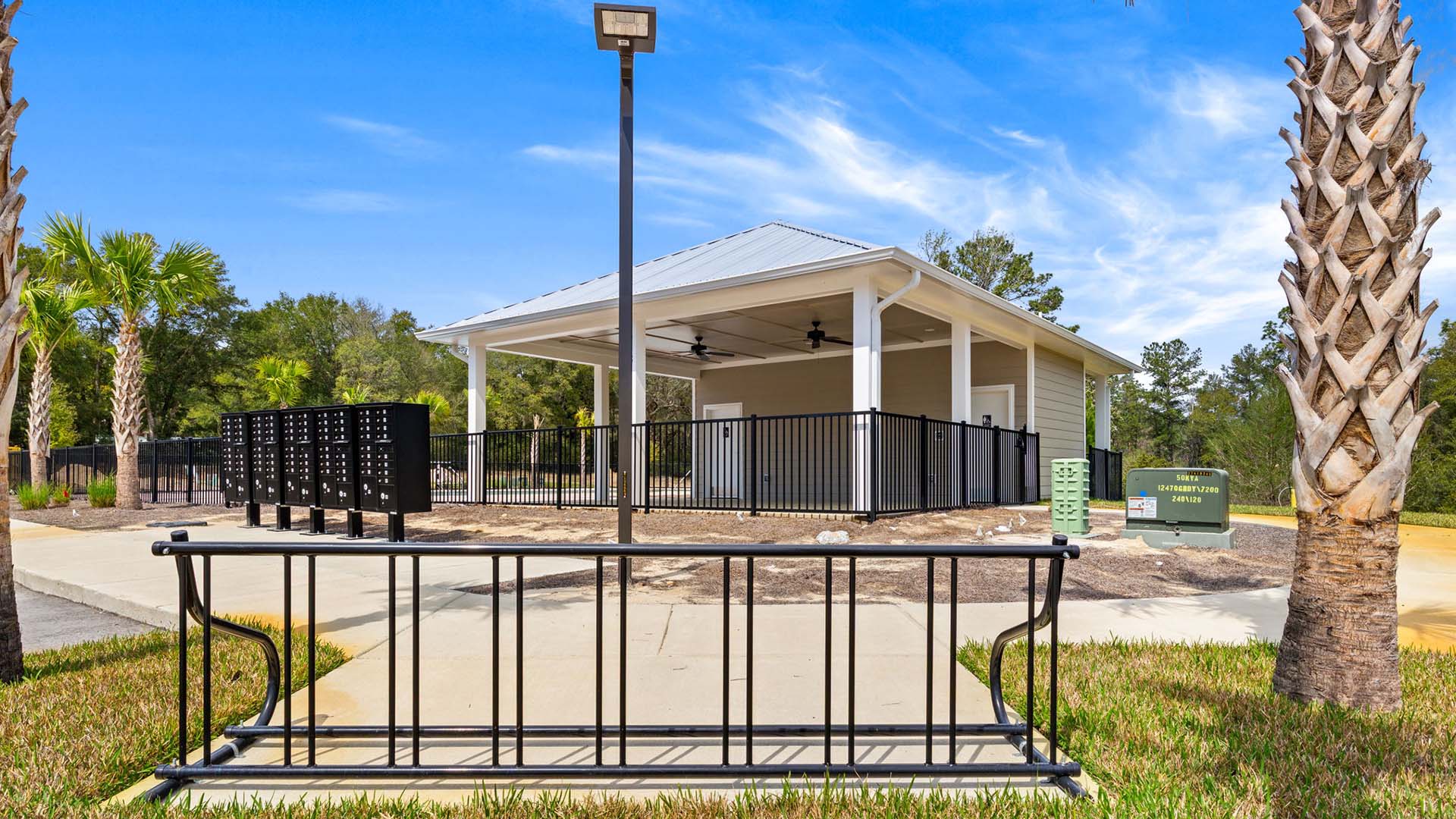 This community has a place to park bicycles by the pool and mailbox area