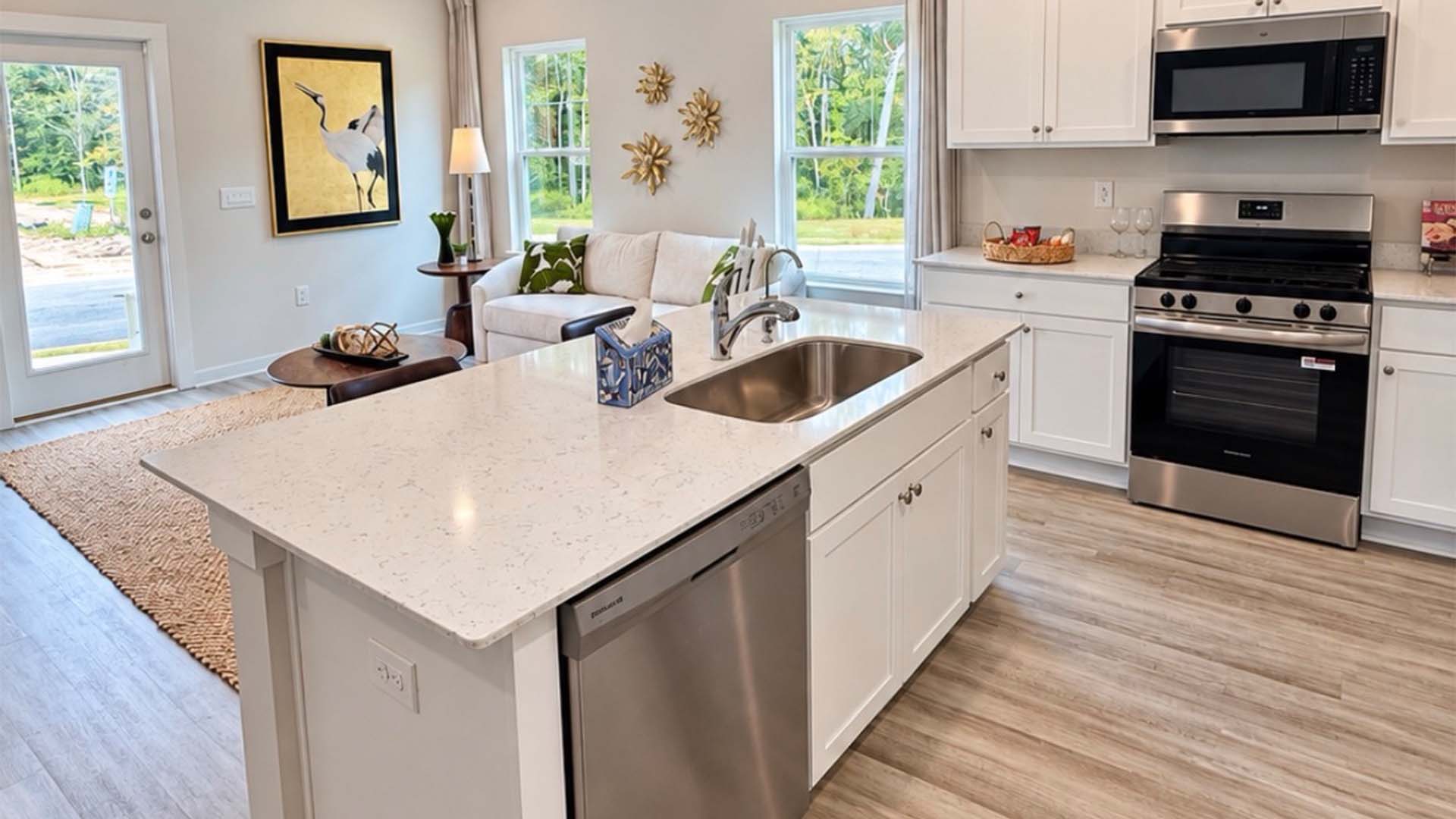 The kitchen has appliances that include a stove microwave and dishwasher