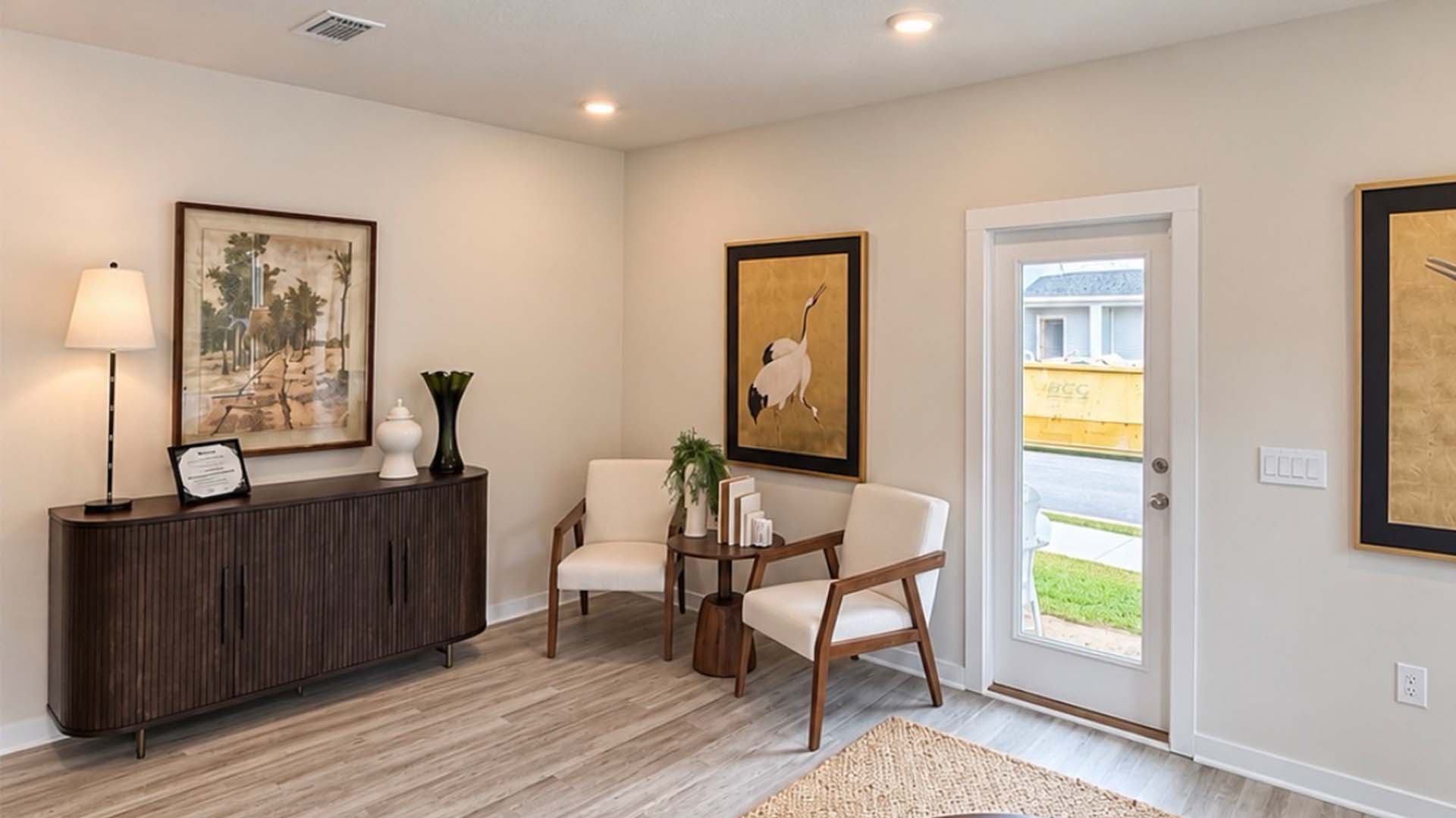 Open living and dining area with access to the back patio