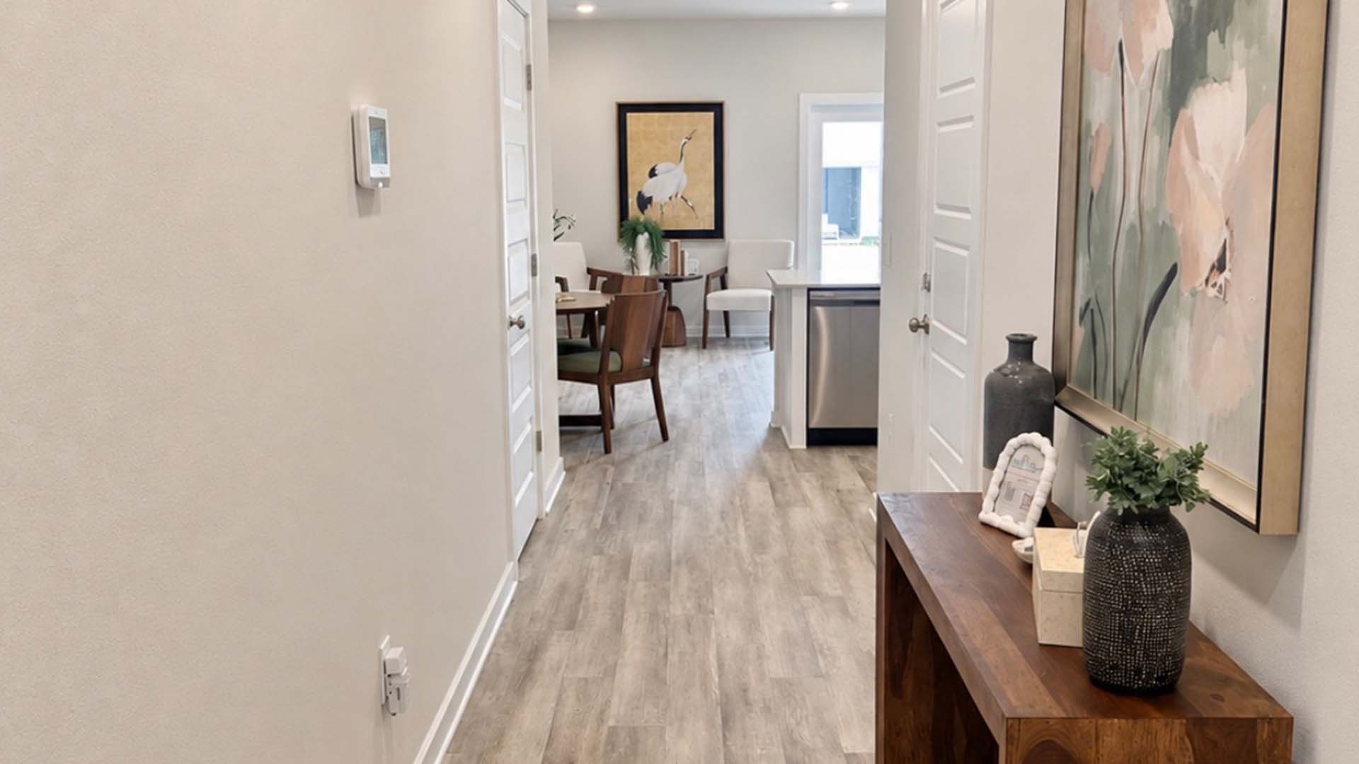 Entry hall with EVP flooring leading to the open living area