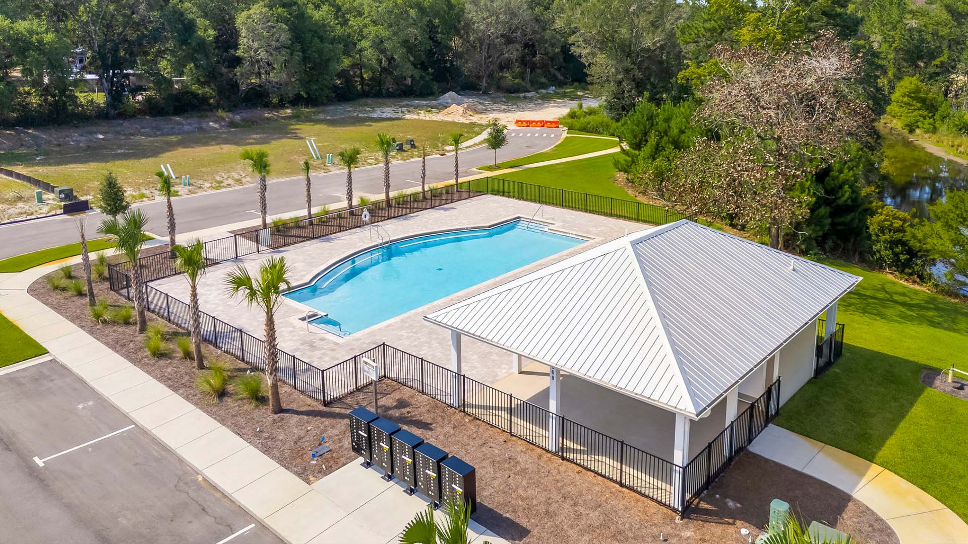 The pool area has a covered pavilion
