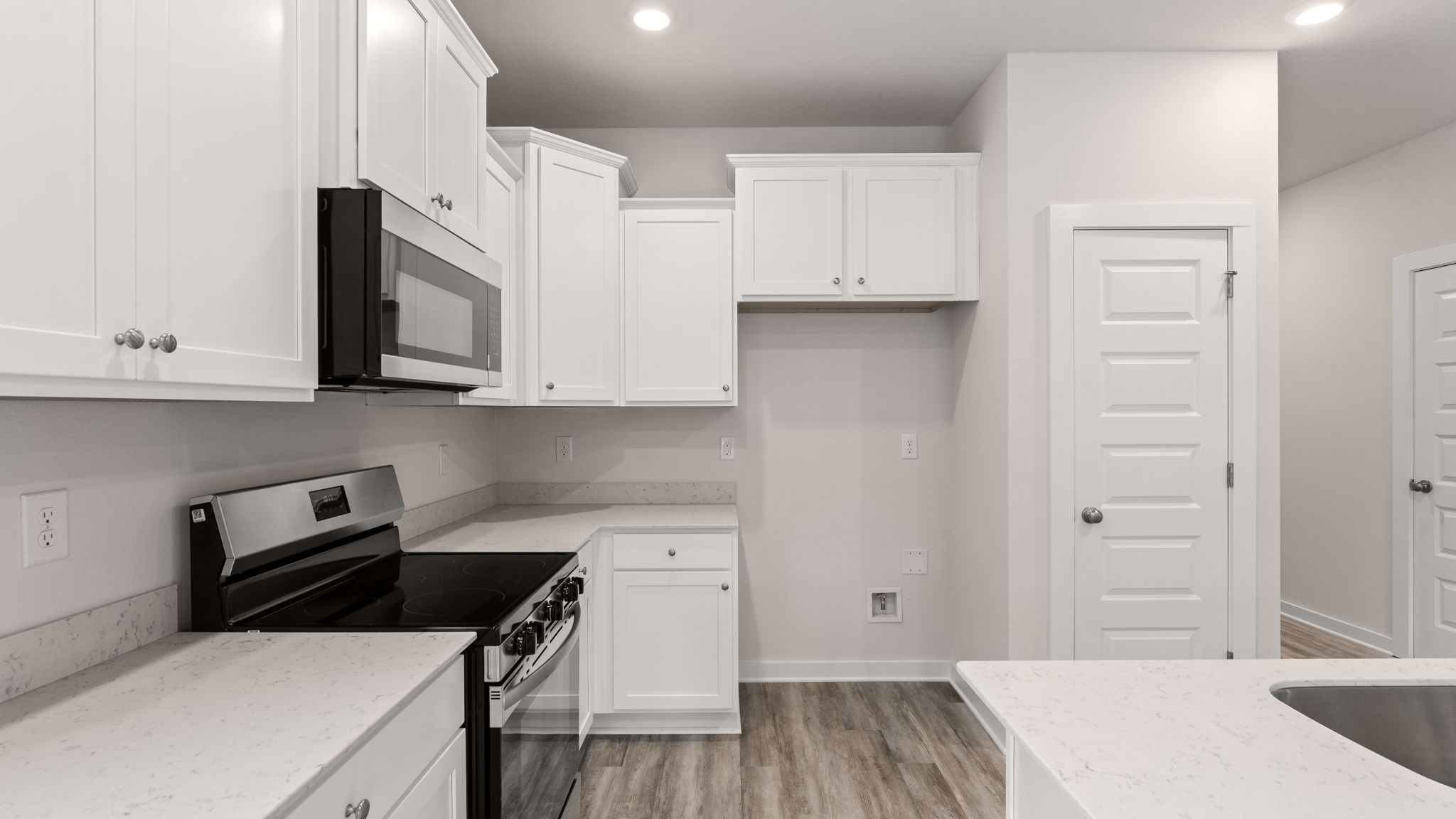 The kitchen has quartz countertops and an appliance package
