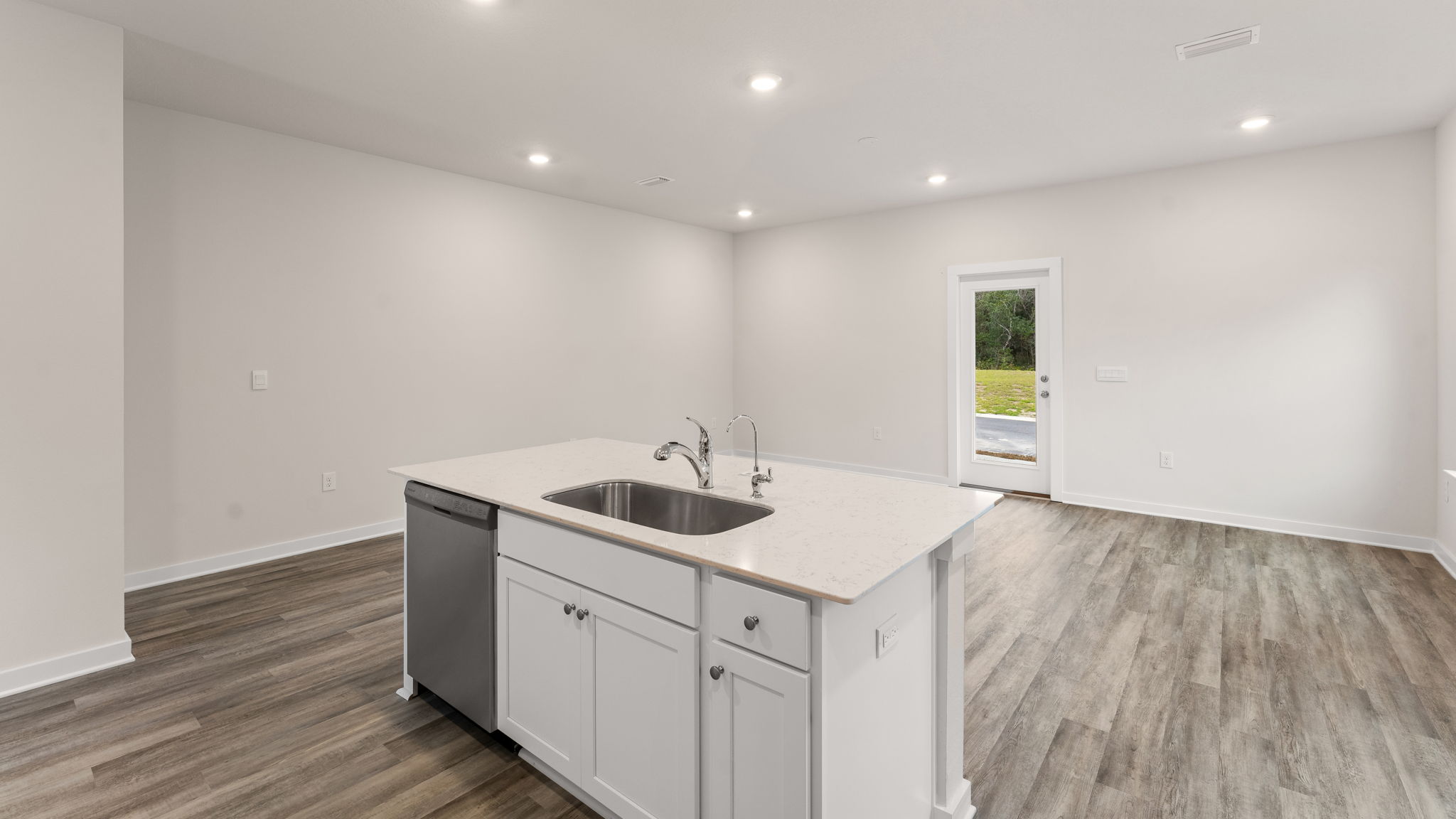 The kitchen has a center island overlooking the dining area
