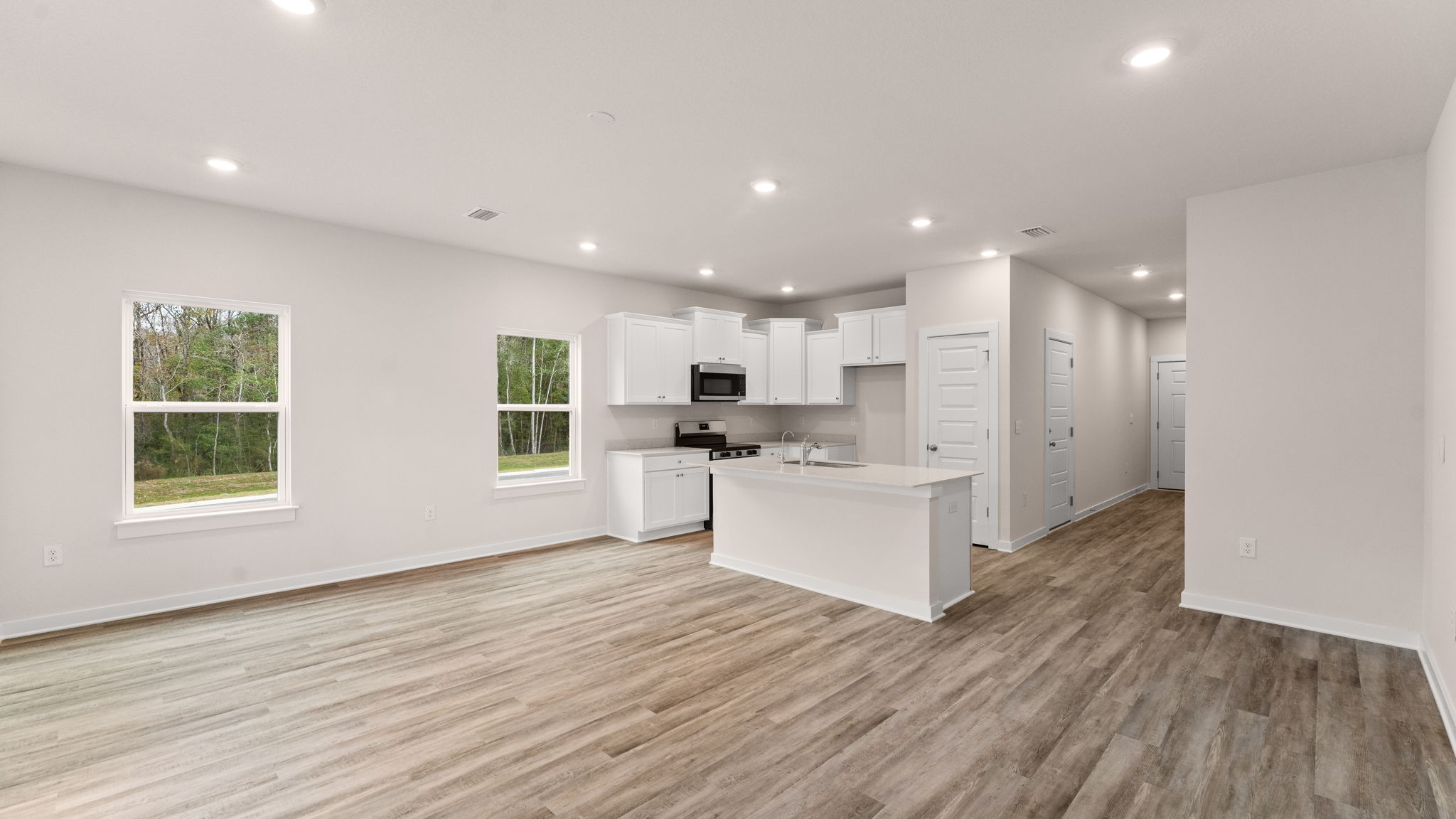 The spacious living area has EVP flooring throughout