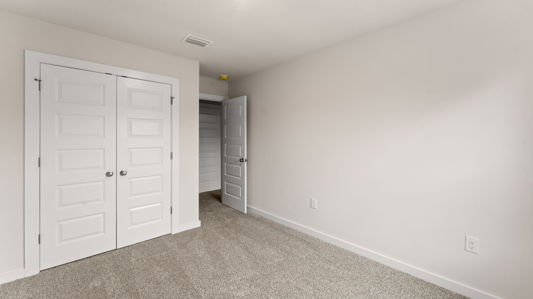Guest bedroom two has ample closet space