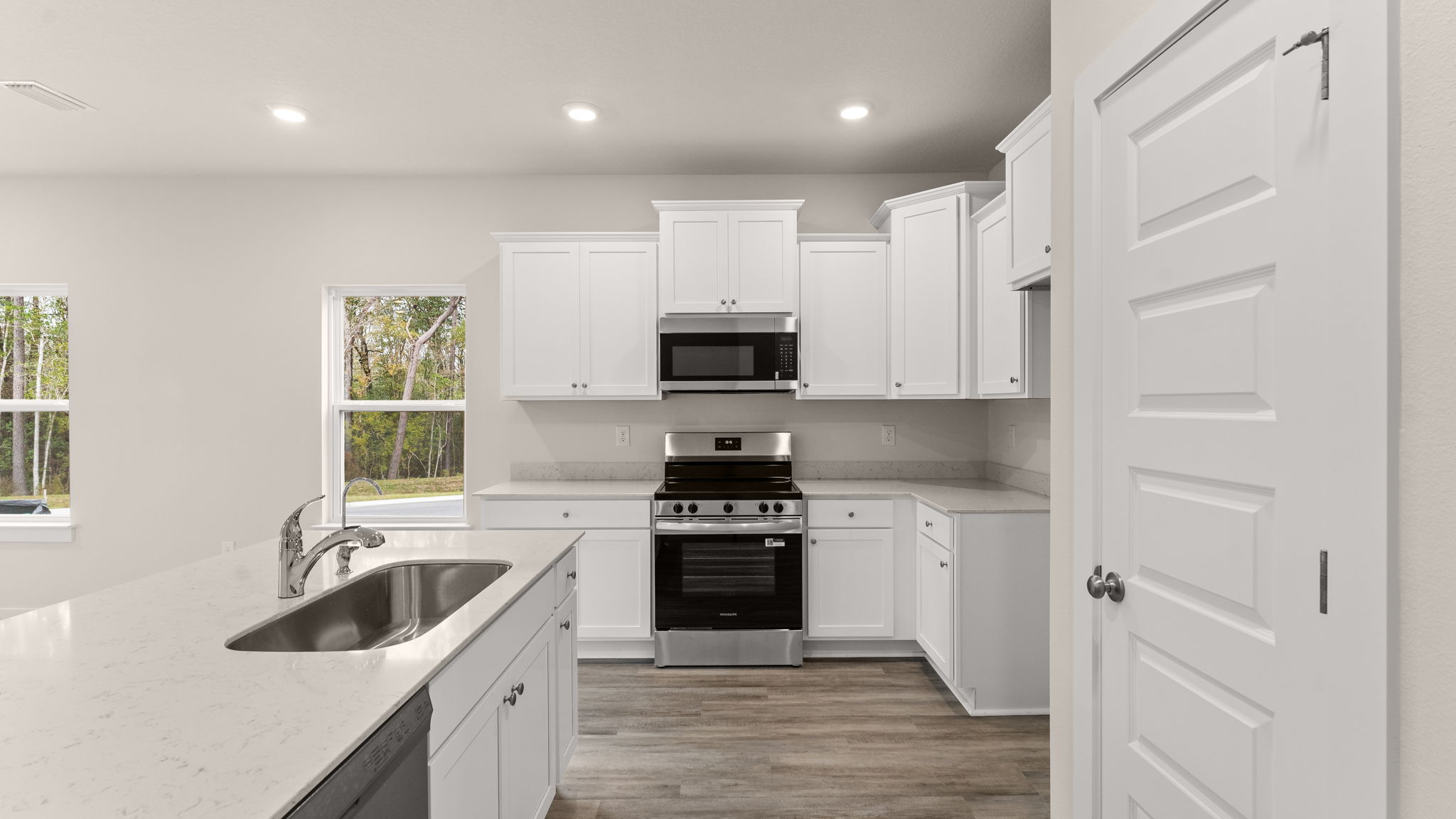 The kitchen is open to the living area and has a pantry for storage