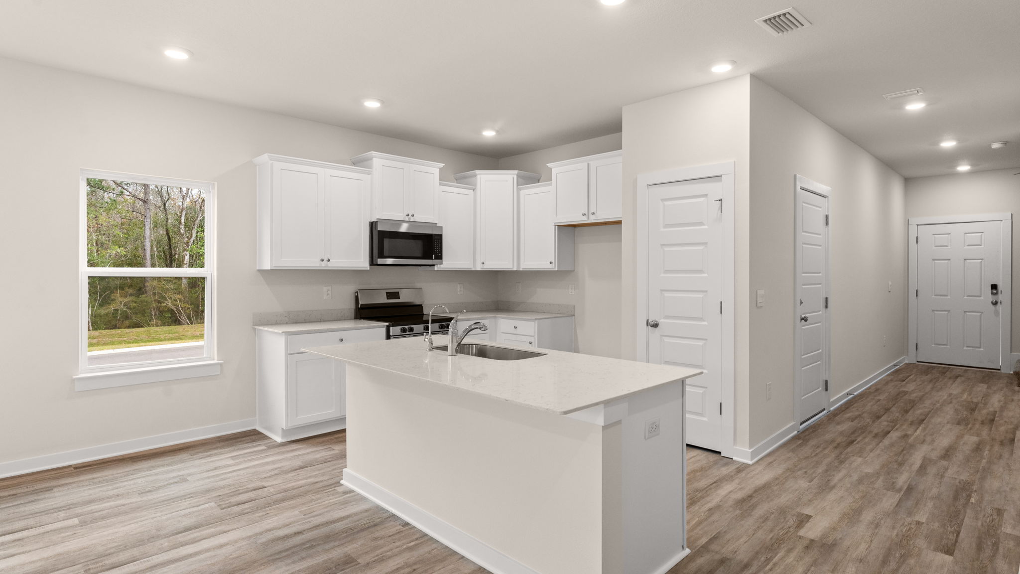 The end unit features exterior windows that illuminate the living space with natural light