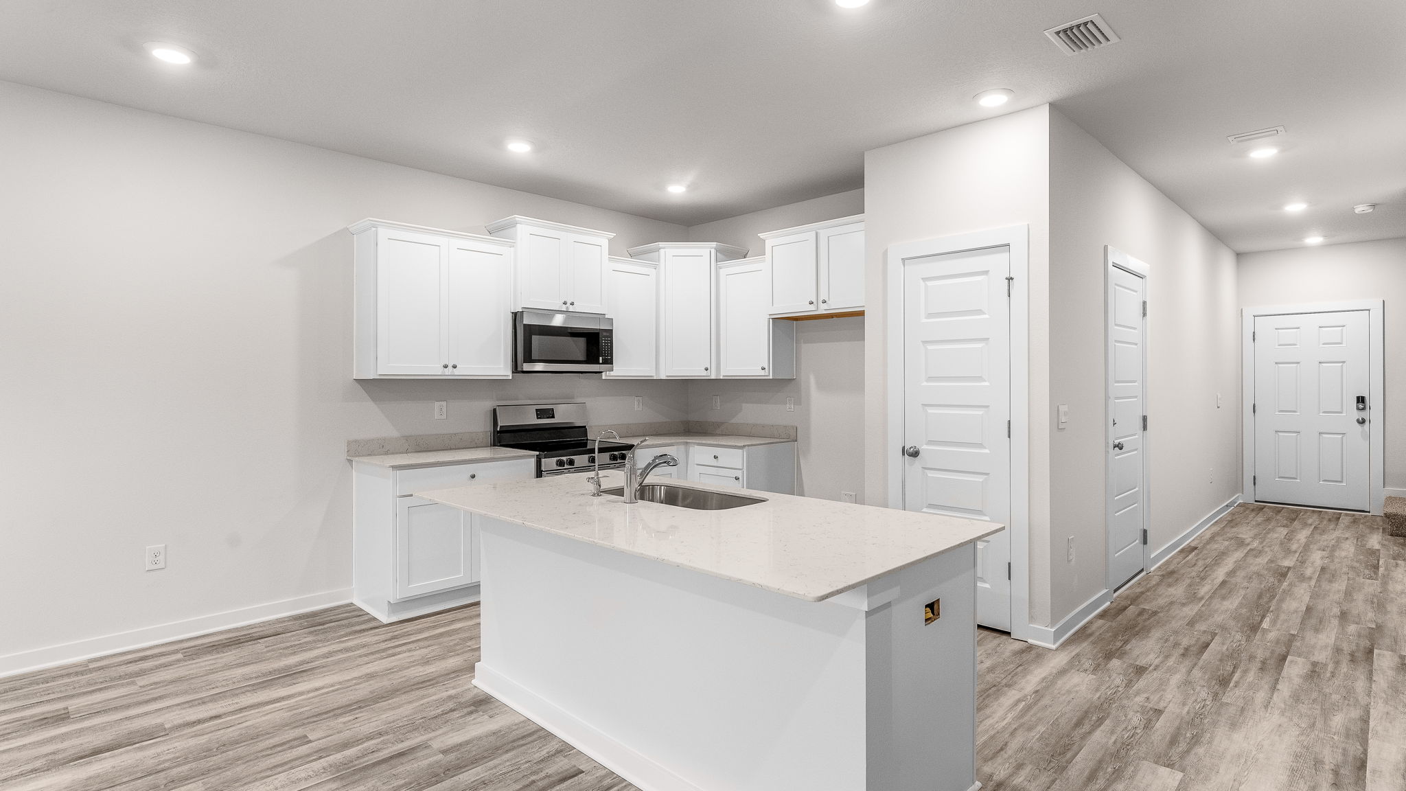 The kitchen is situated looking out to the dining and living areas