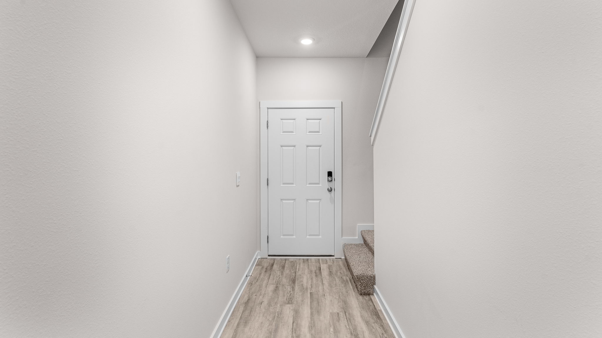 The living area is open and spacious with EVP flooring and open kitchen