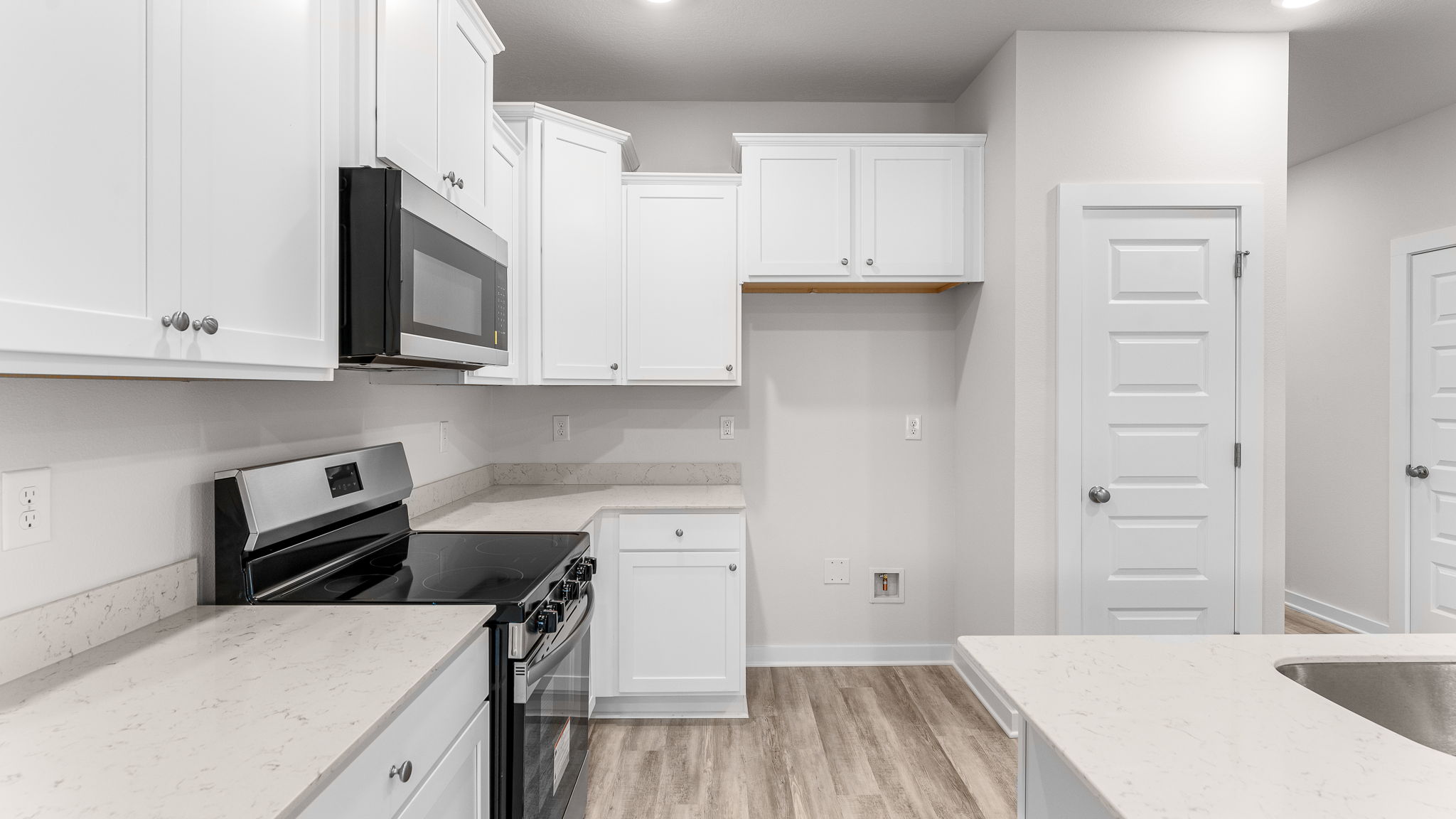 The kitchen island holds the sink and dishwasher