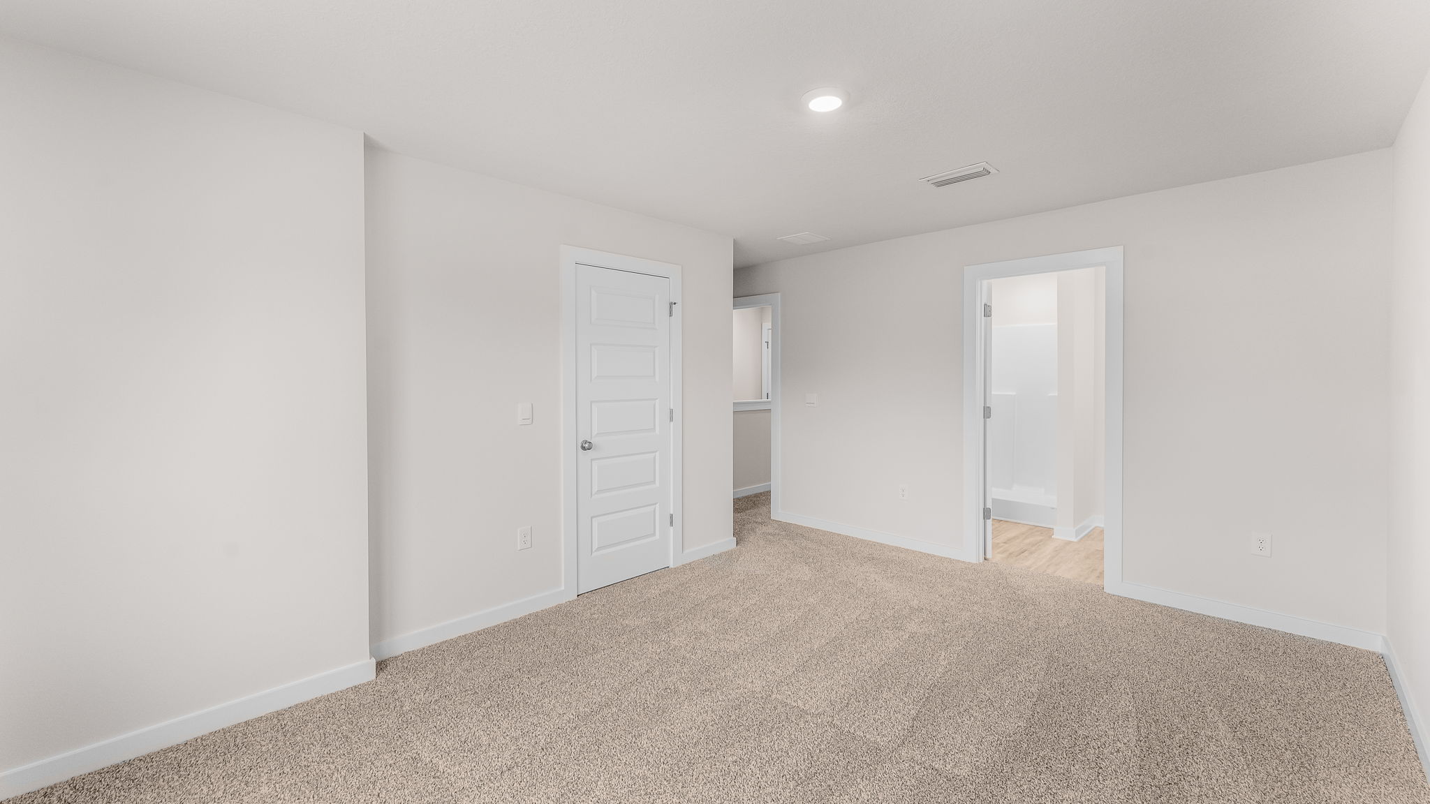 The primary bedroom has a spacious closet and ensuite bathroom
