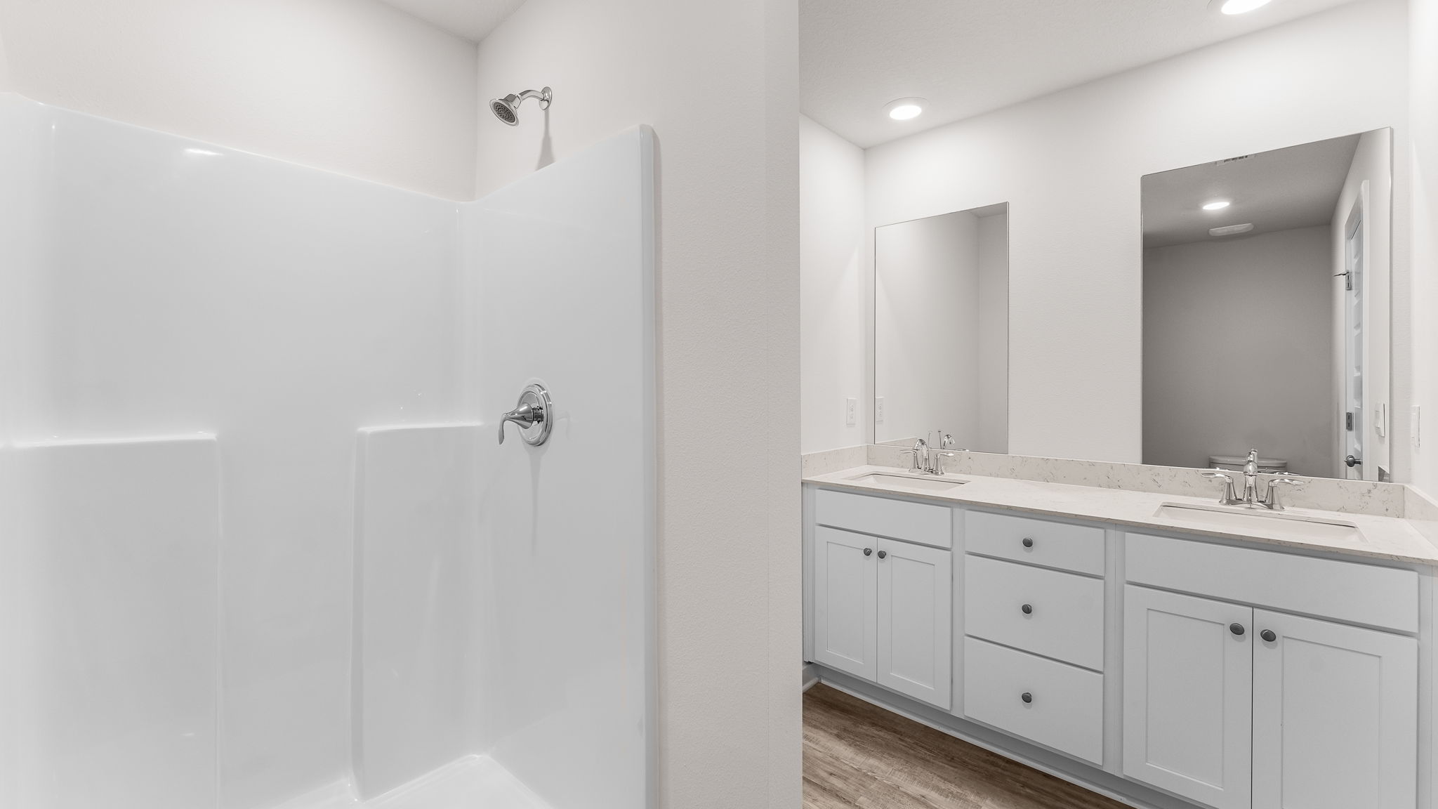 The primary bathroom has a shower and a linen storage area