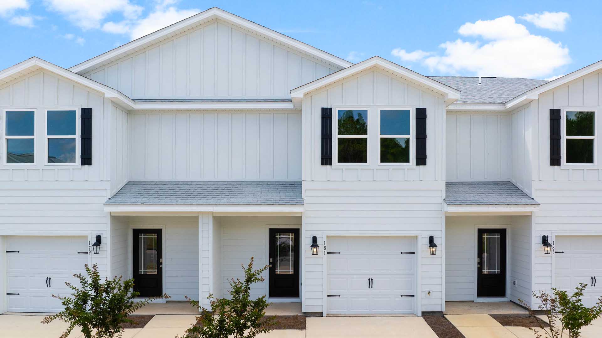 The exterior of the Palm Townhomes at Genoa Landing has vinyl siding