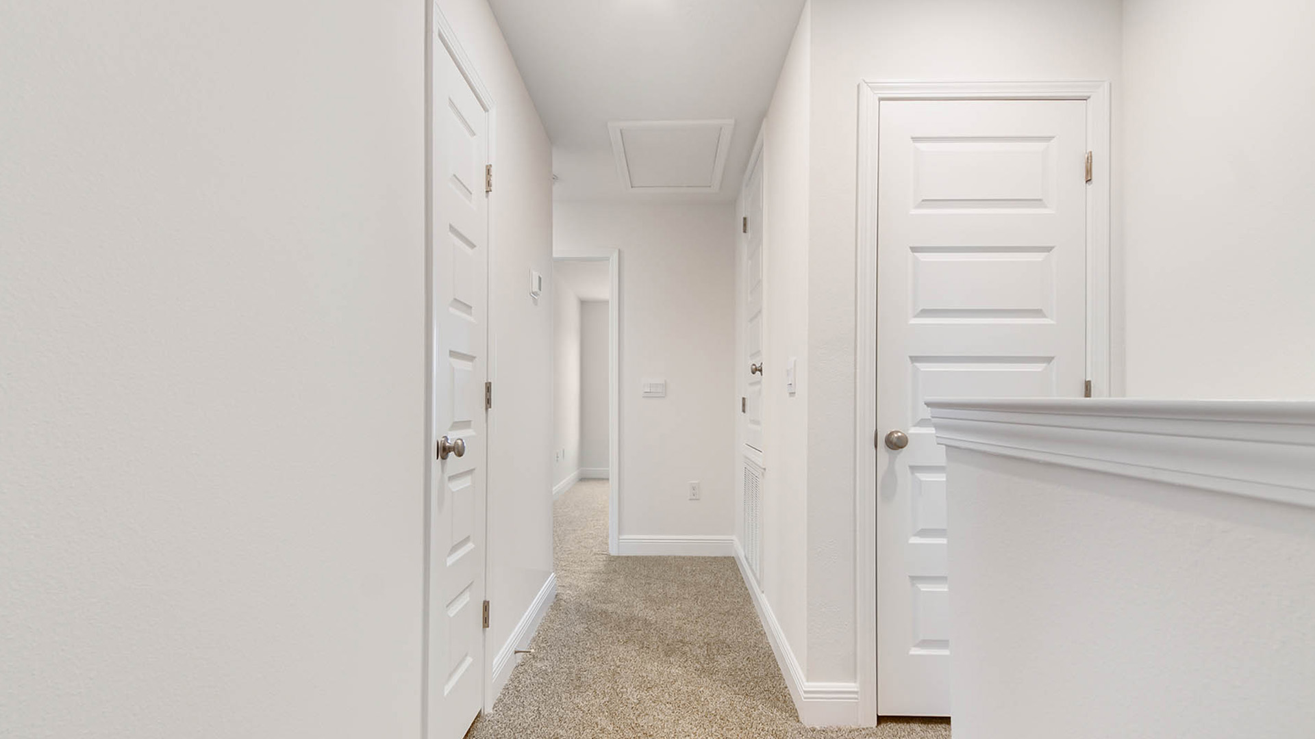 Primary bathroom with beautiful white cabinetry and granite countertops
