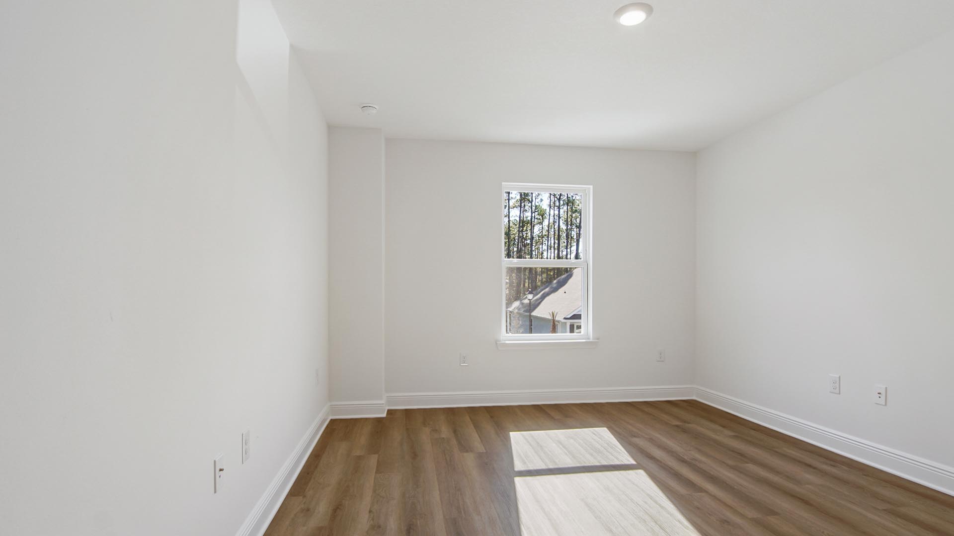 Bedroom three is located on the second level overlooking the front lawn