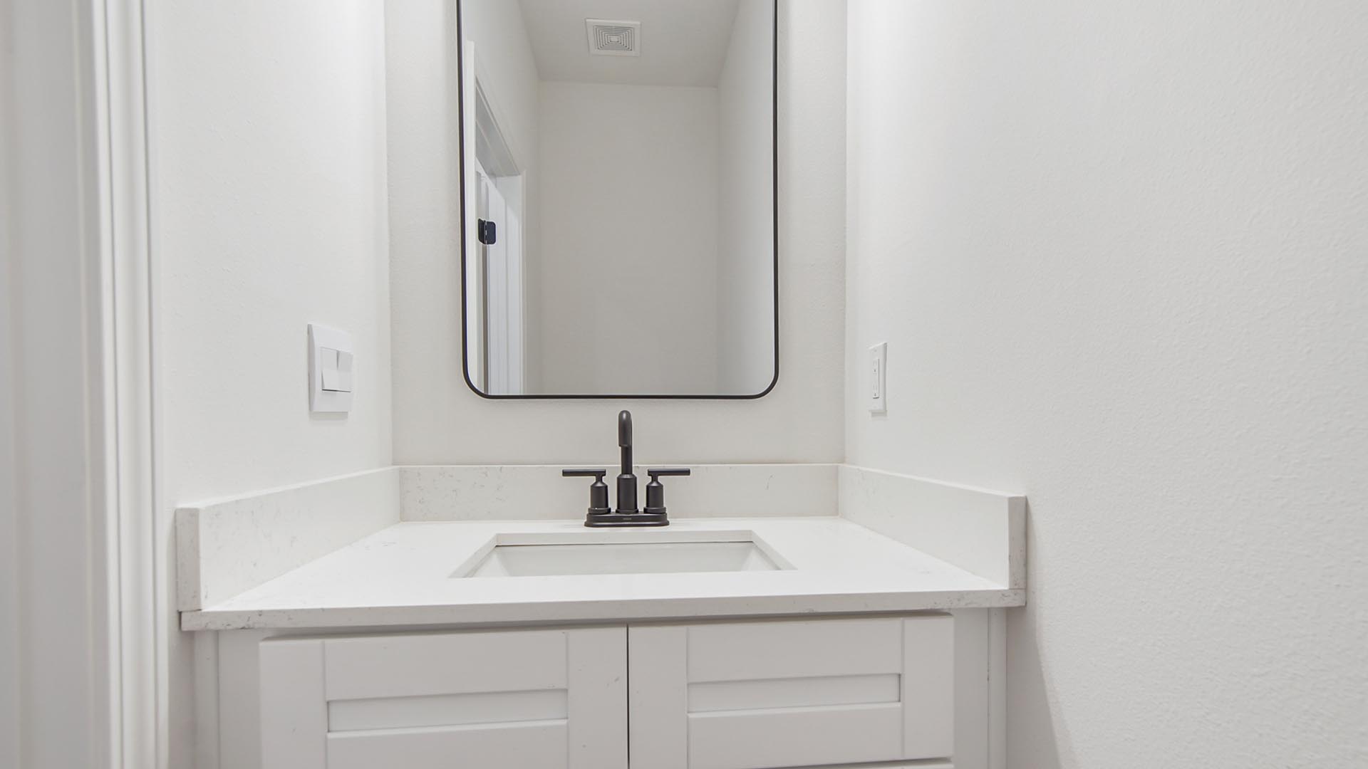 Powder bath features a single vanity