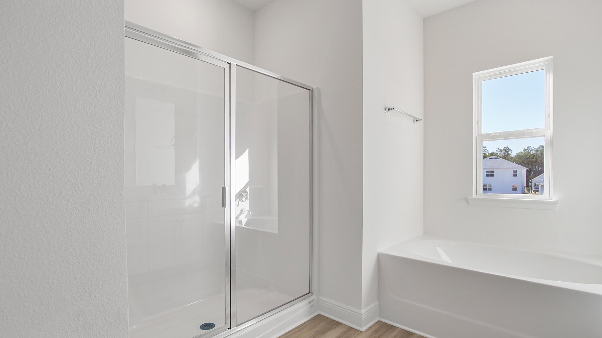 The primary bathroom offers a luxurious feel