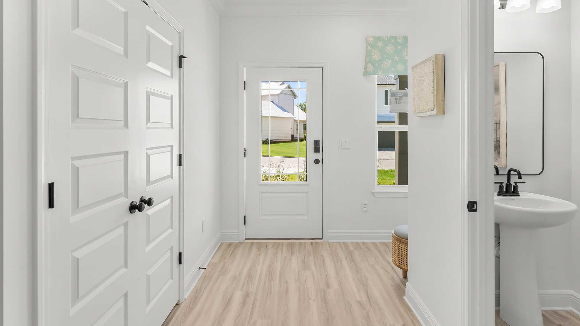 Bright entry with EVP flooring leading to the main living area