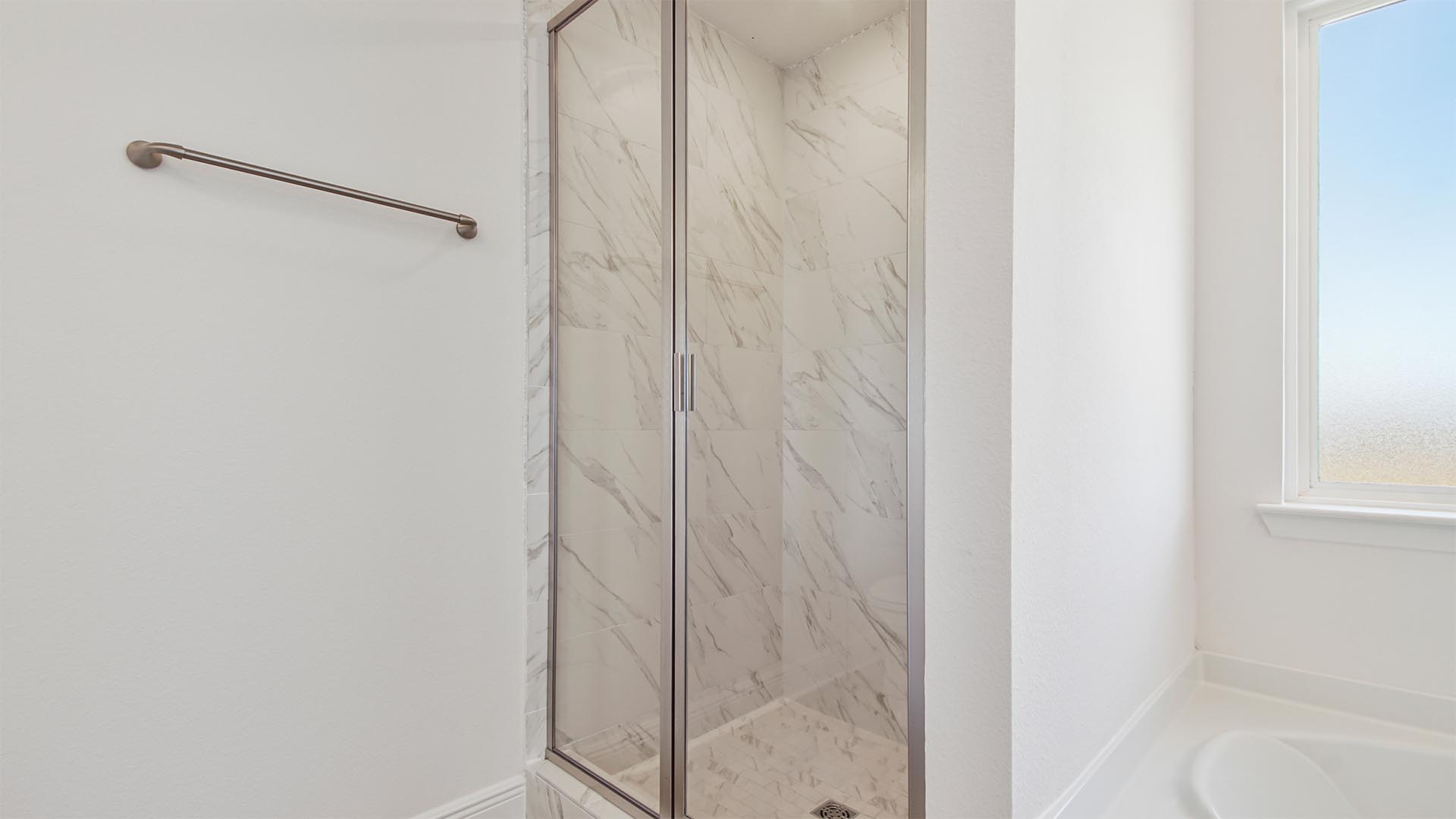 The primary bathroom has a separate shower