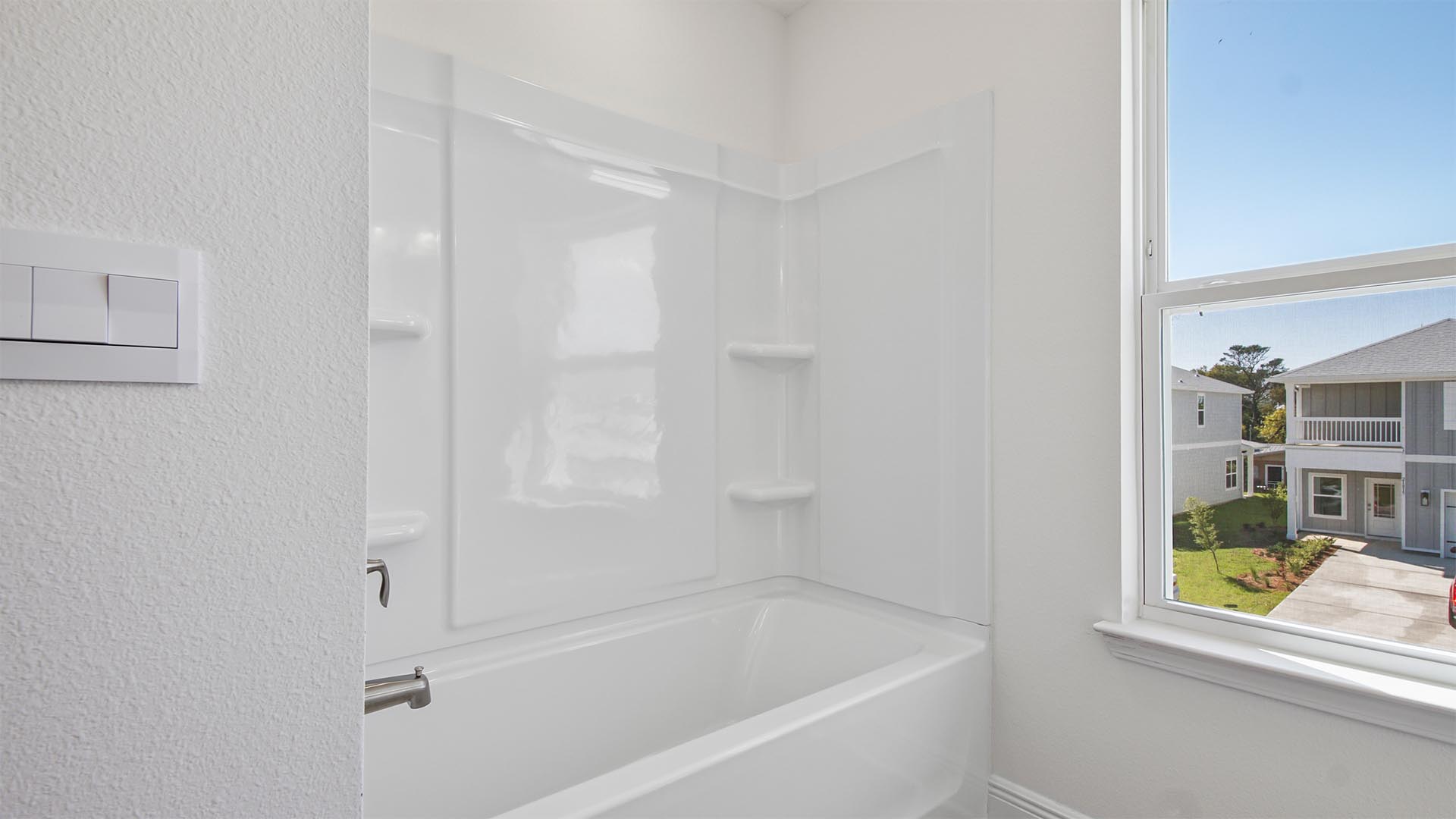 The shared bathroom has shower tub combination