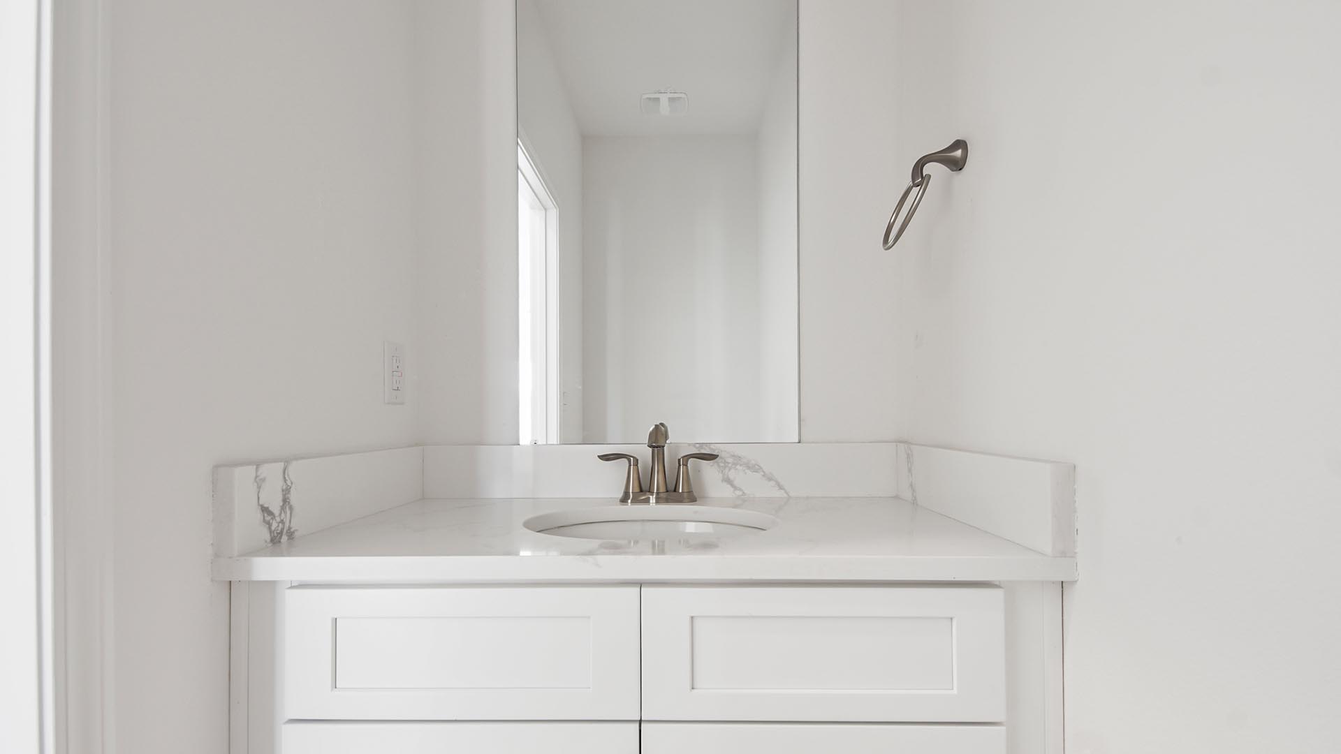 The powder room has a vanity
