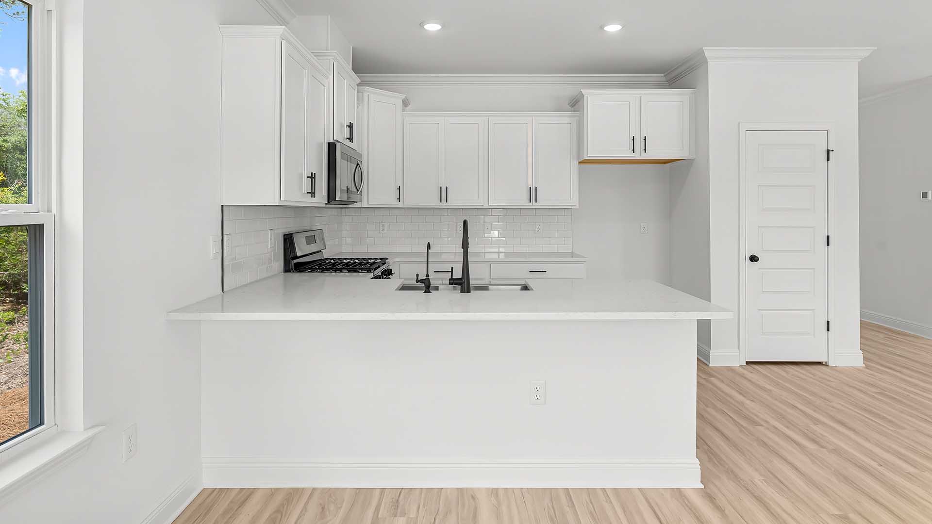 The kitchen has a pantry for storage