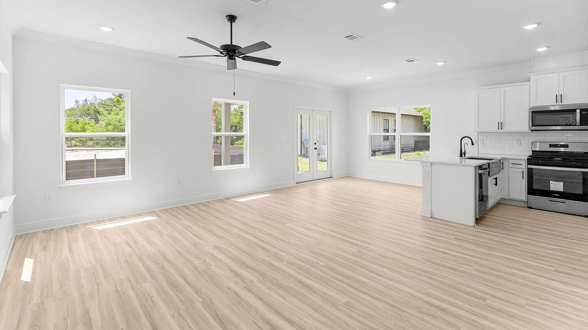 The main level has a grand living space with EVP flooring