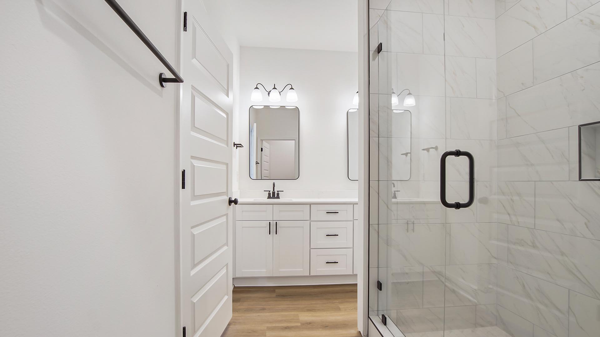 The primary bath has EVP flooring