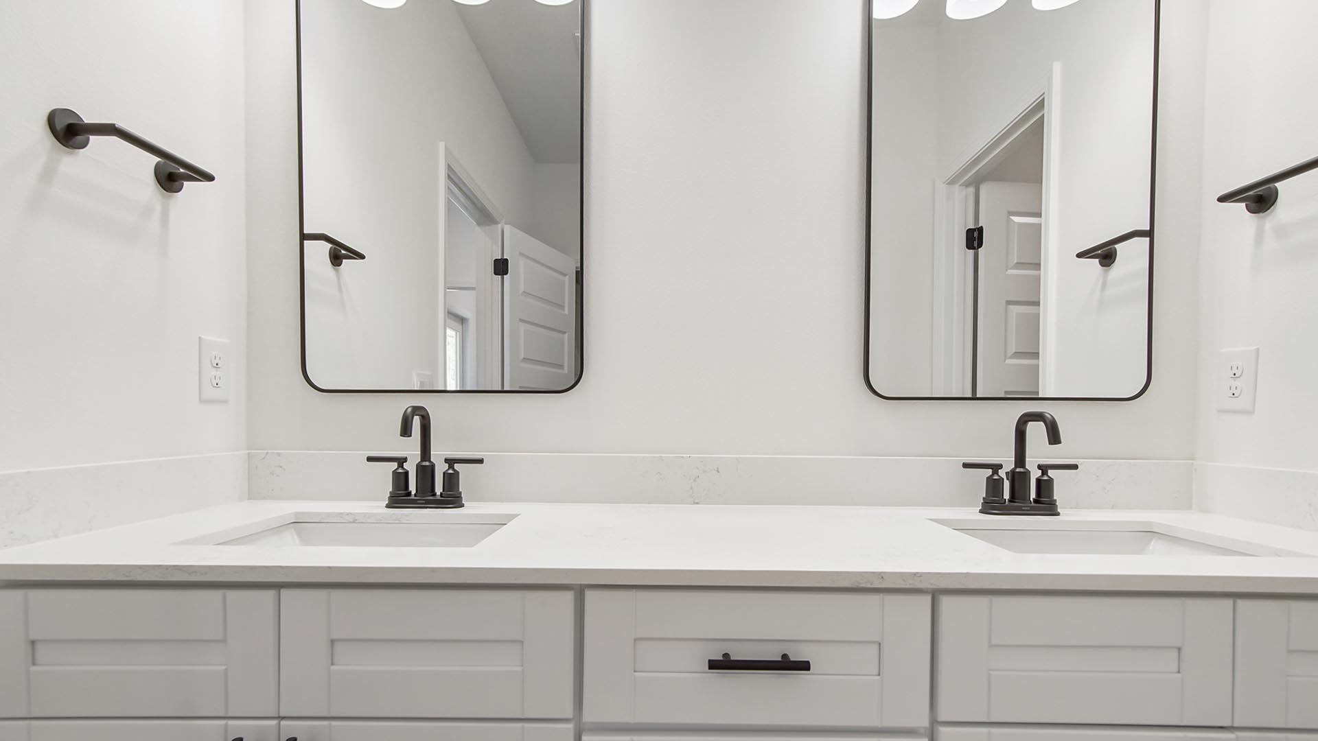 The primary bathroom has adequate storage at the vanity