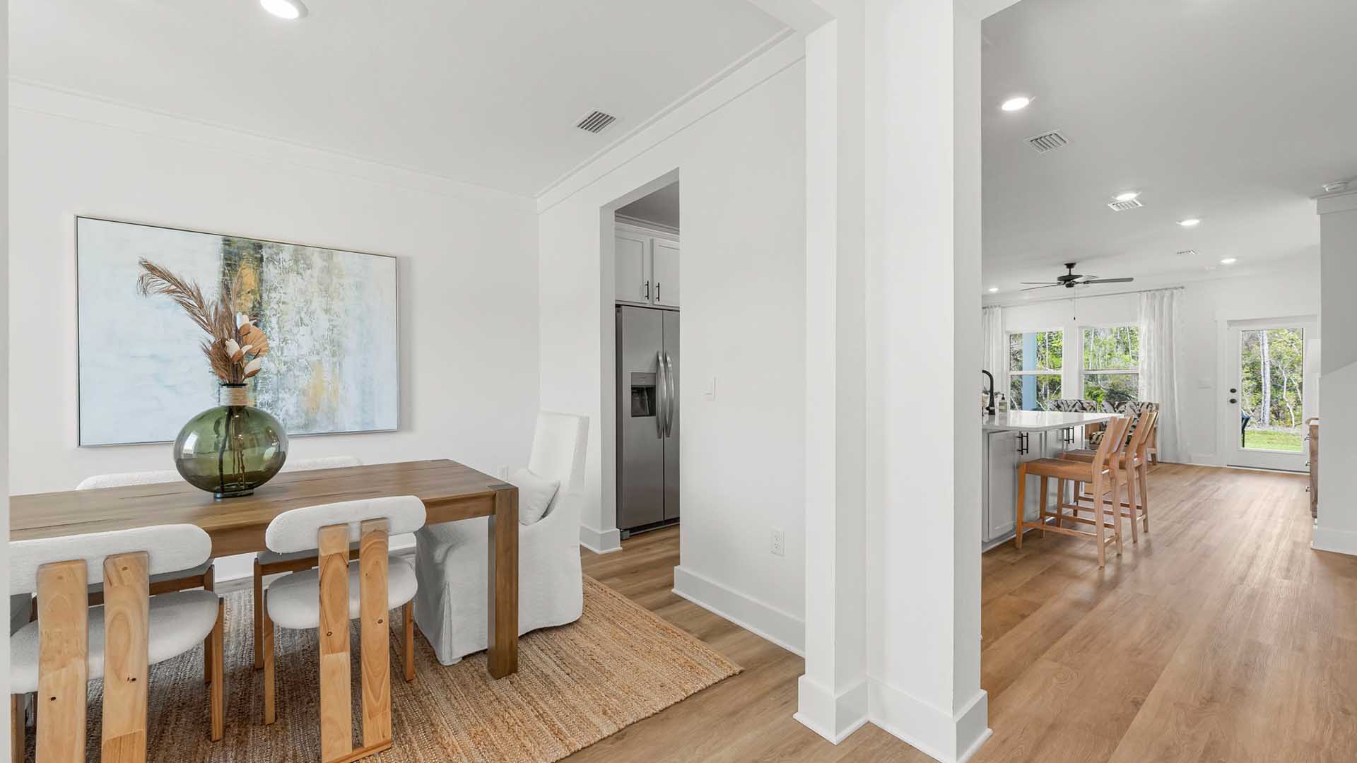 The dining room has a dedicated hall leading to the kitchen