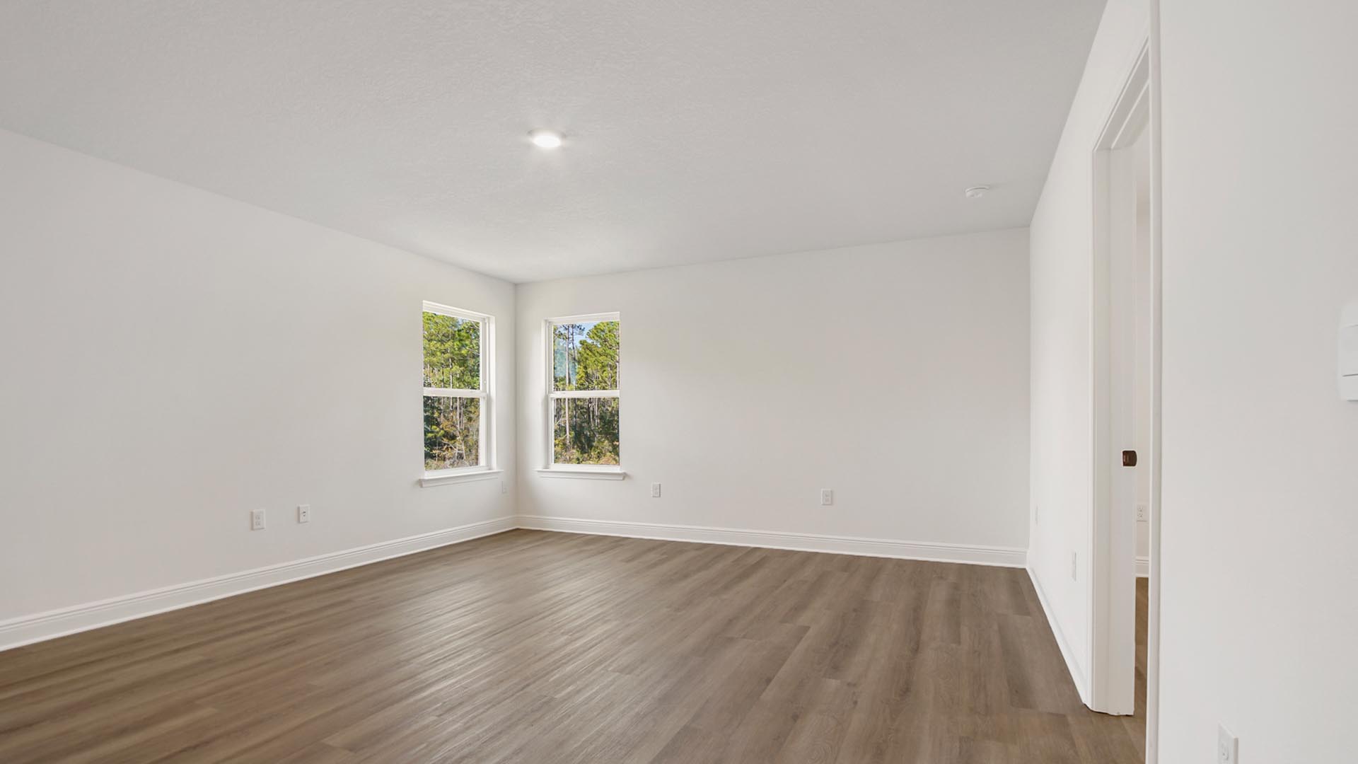 The second level has a large flex space that could be used as a game room or media area or second living room