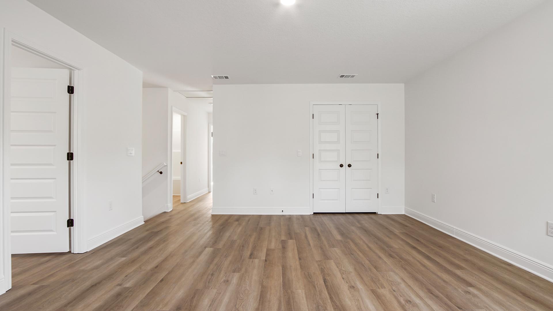 The upstairs living area has EVP flooring