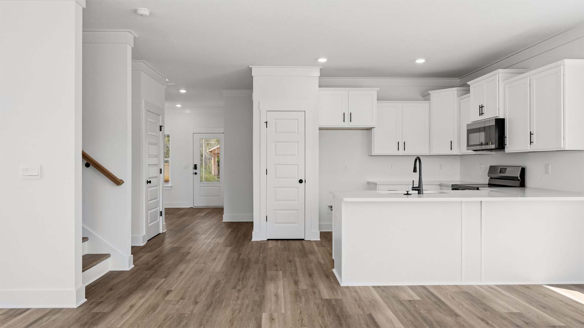 The open kitchen has a small pantry for storage