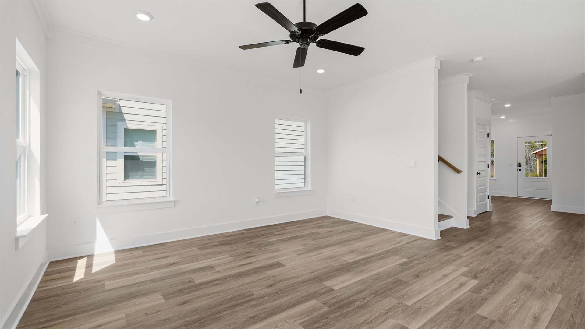 The living area can accommodate a sofa, chairs and coffee table
