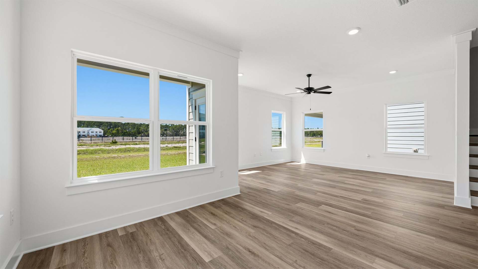 A large picture window illuminate the dining area