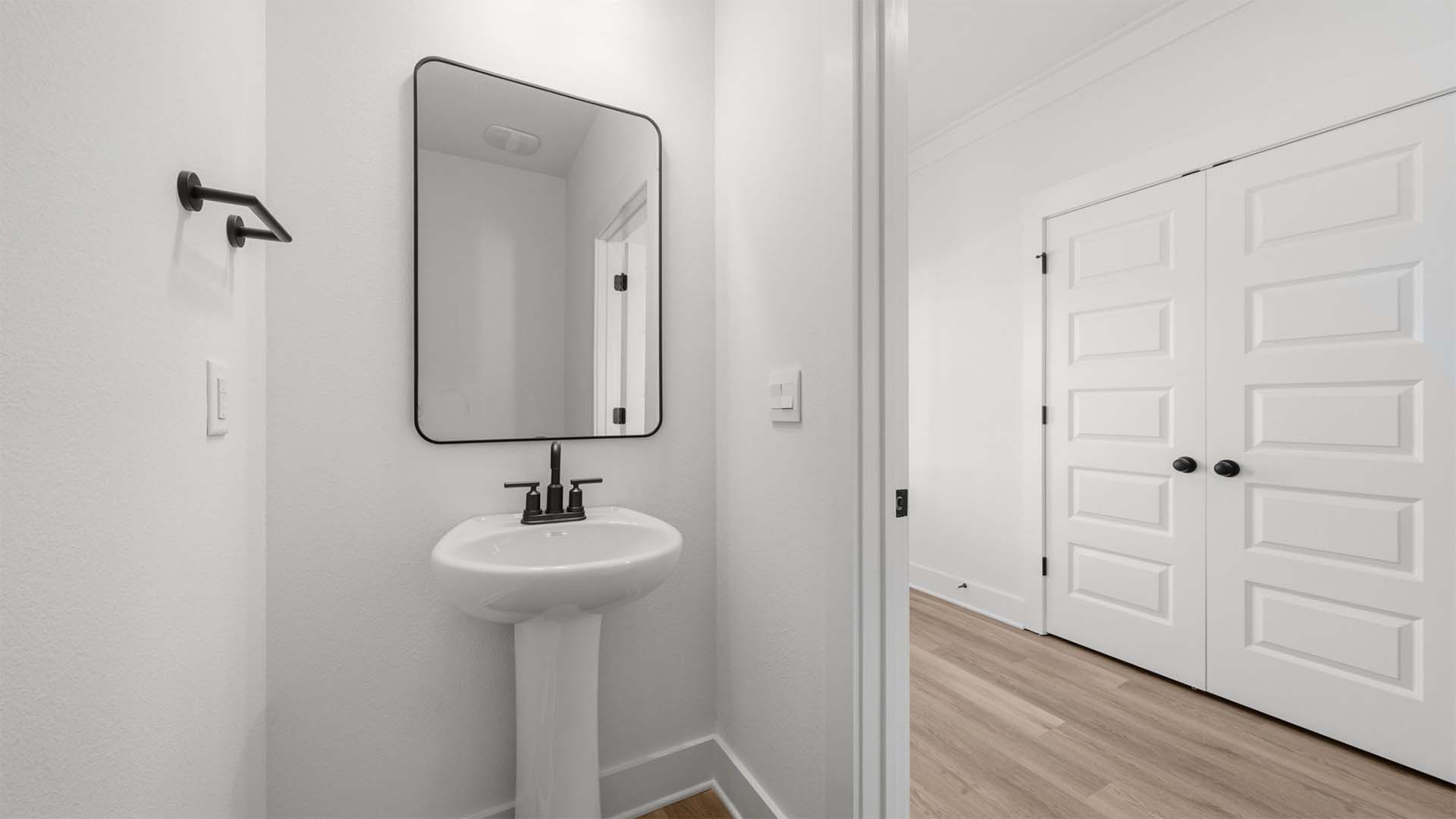 There is a half bath on the main level with a pedestal sink