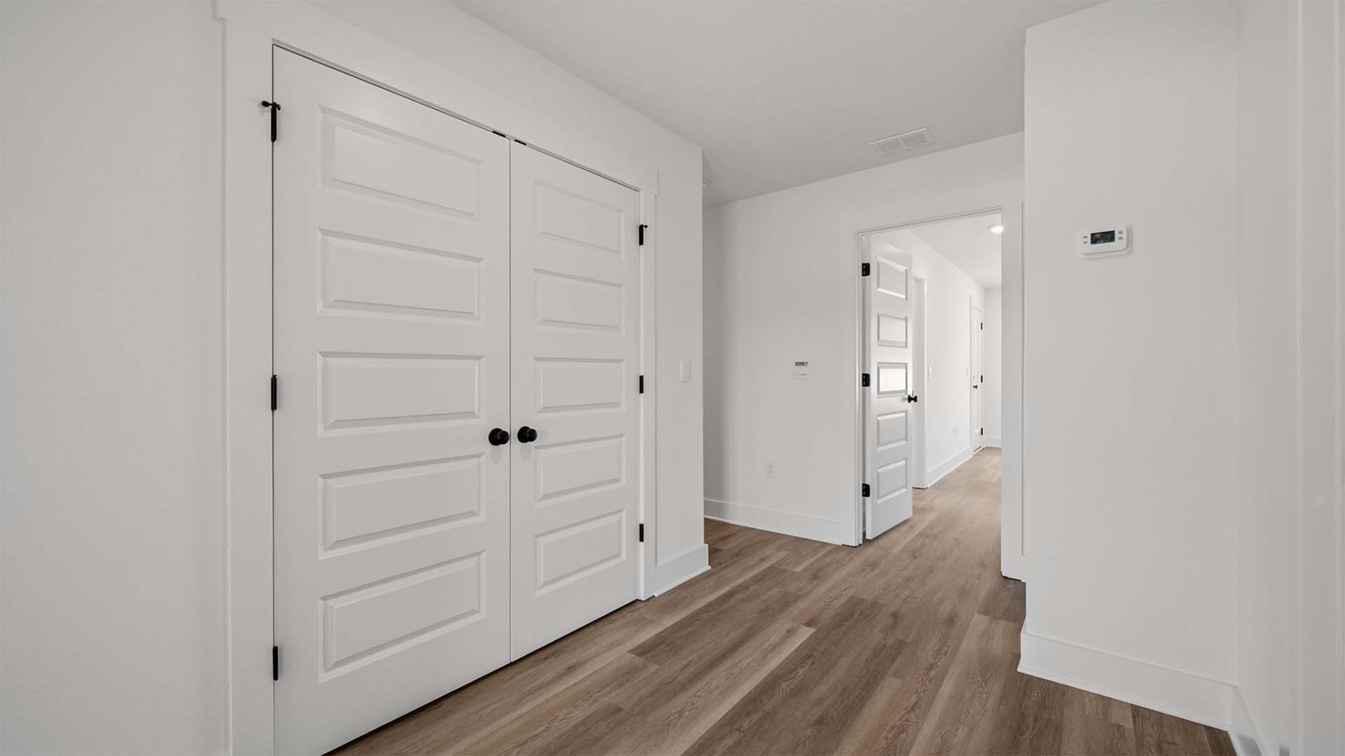The laundry area is located at the top of the second level stairs