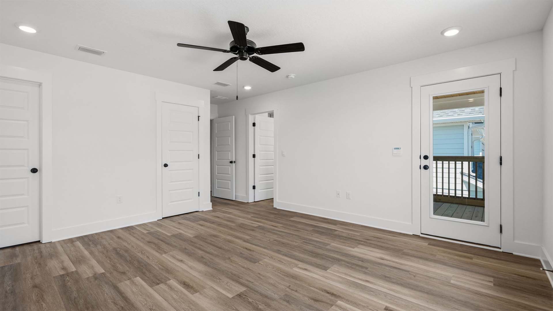 The primary bedroom has EVP flooring and a private balcony