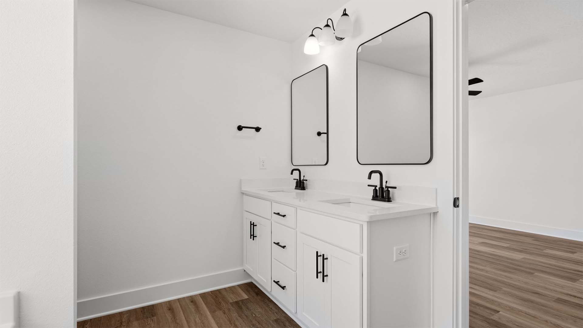 The primary bath has a dual sink vanity