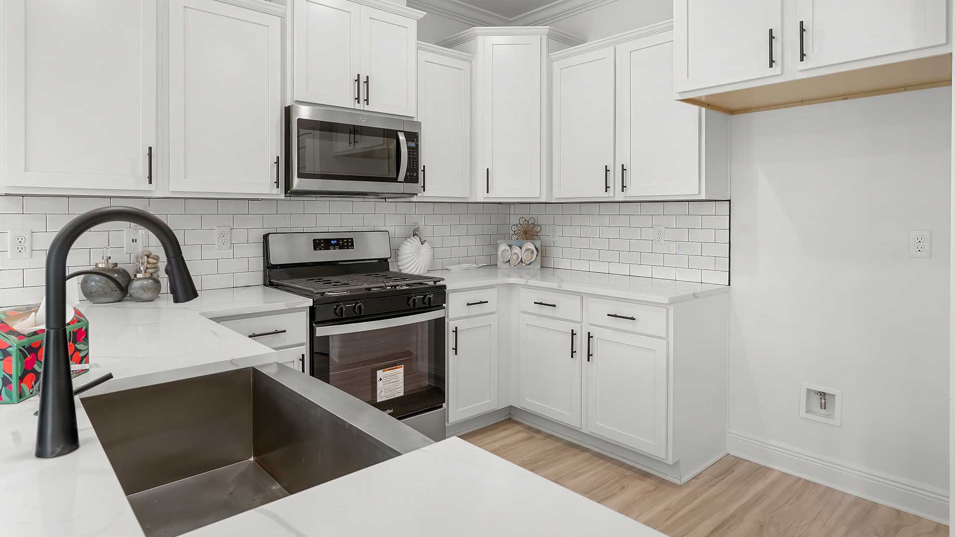 The kitchen has a peninsula bar with space for seating