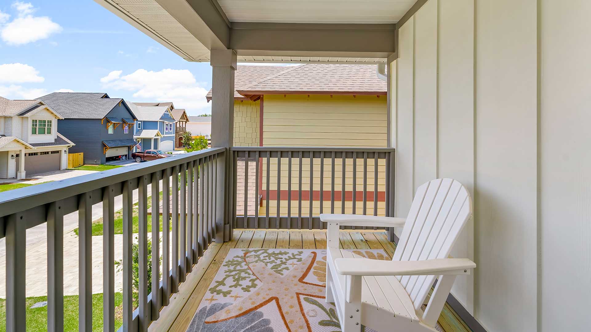 The primary bedroom has a private balcony