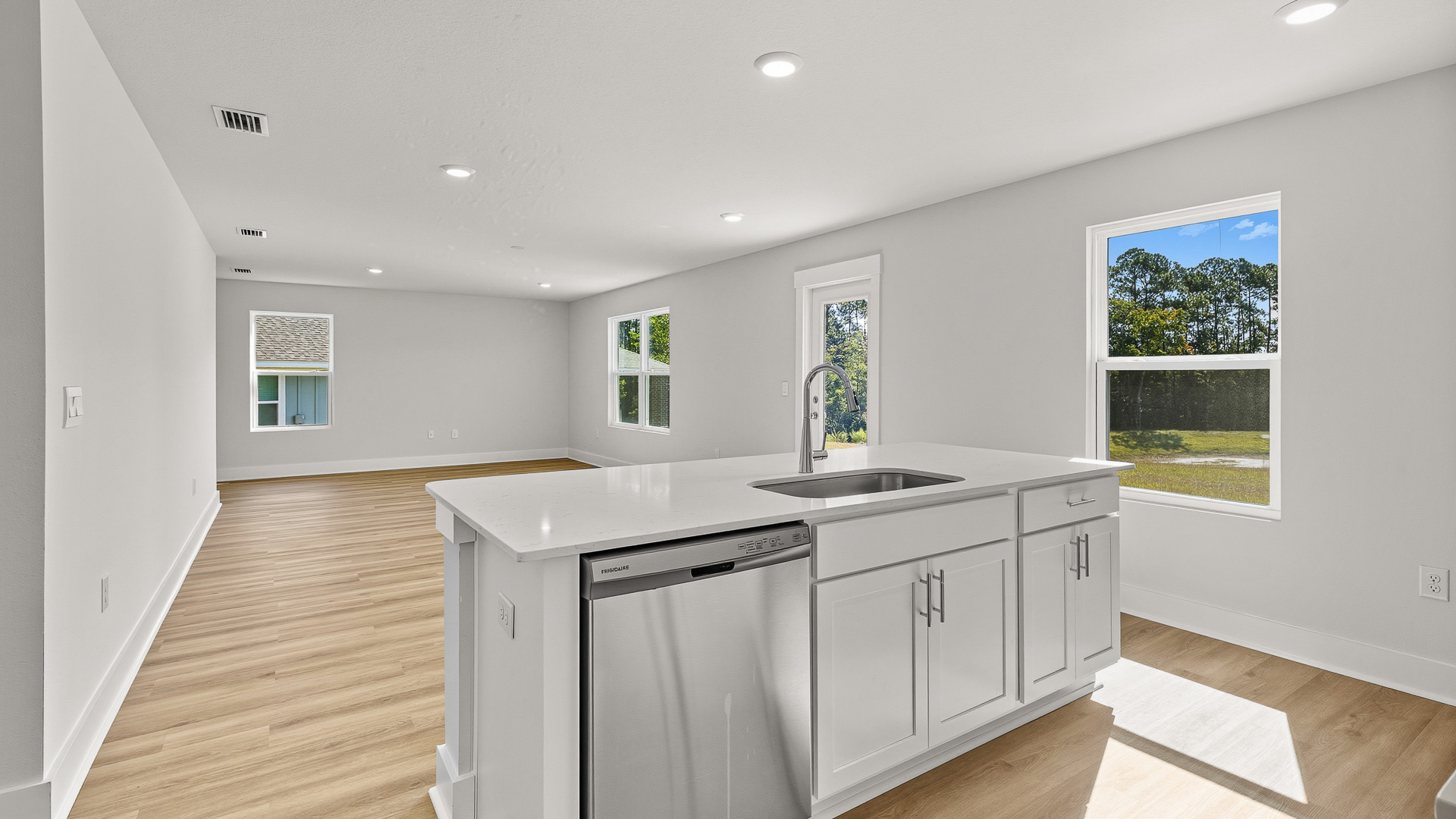 The kitchen island faces out to the living area