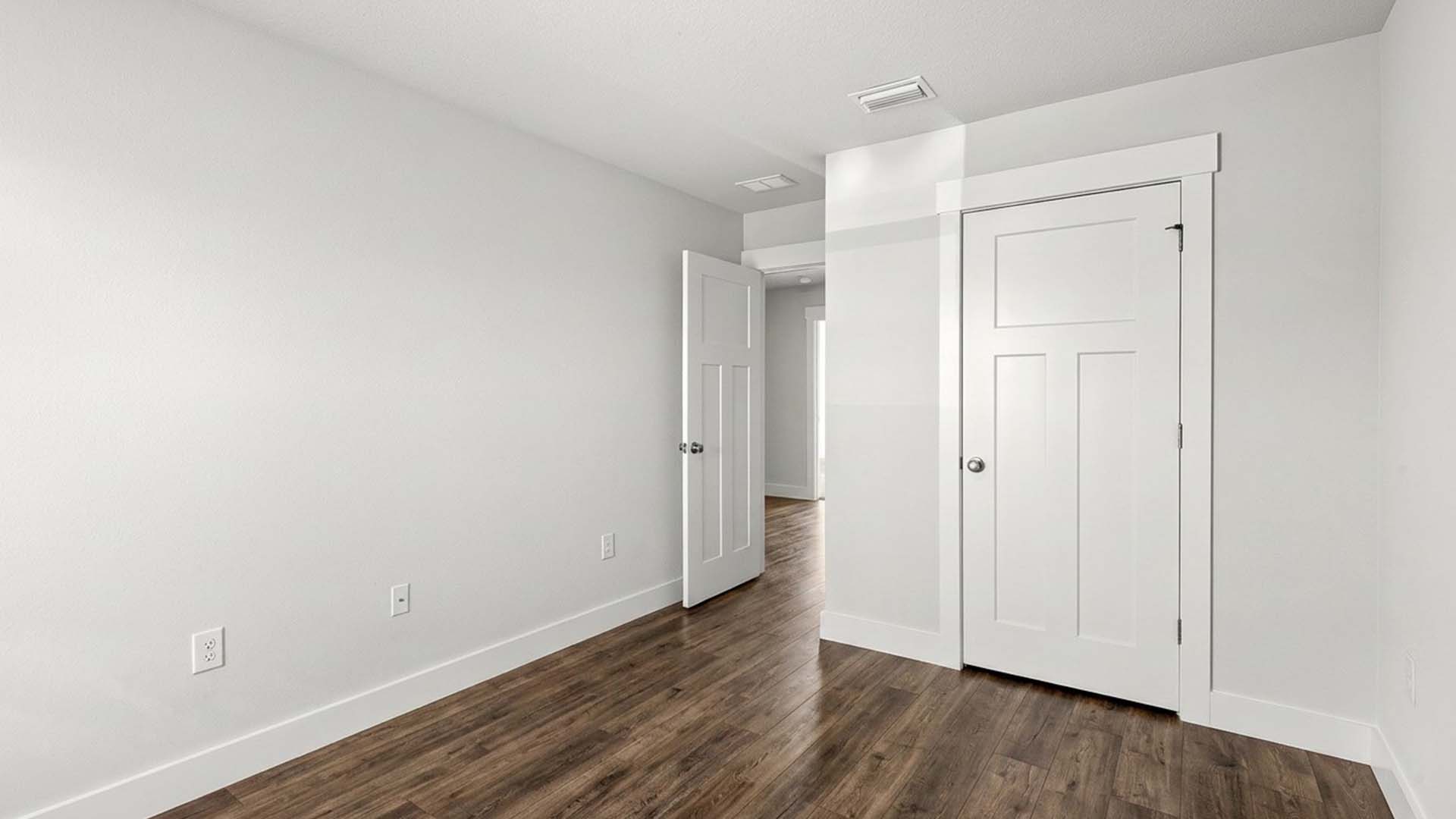 Guest bedroom three with EVP flooring