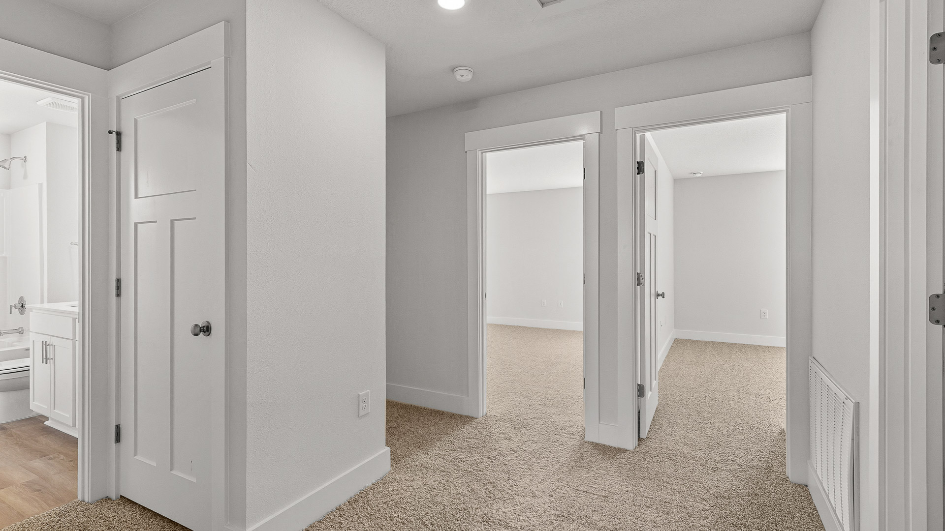 Upstairs hallway leading to guest bedrooms and the full bathroom