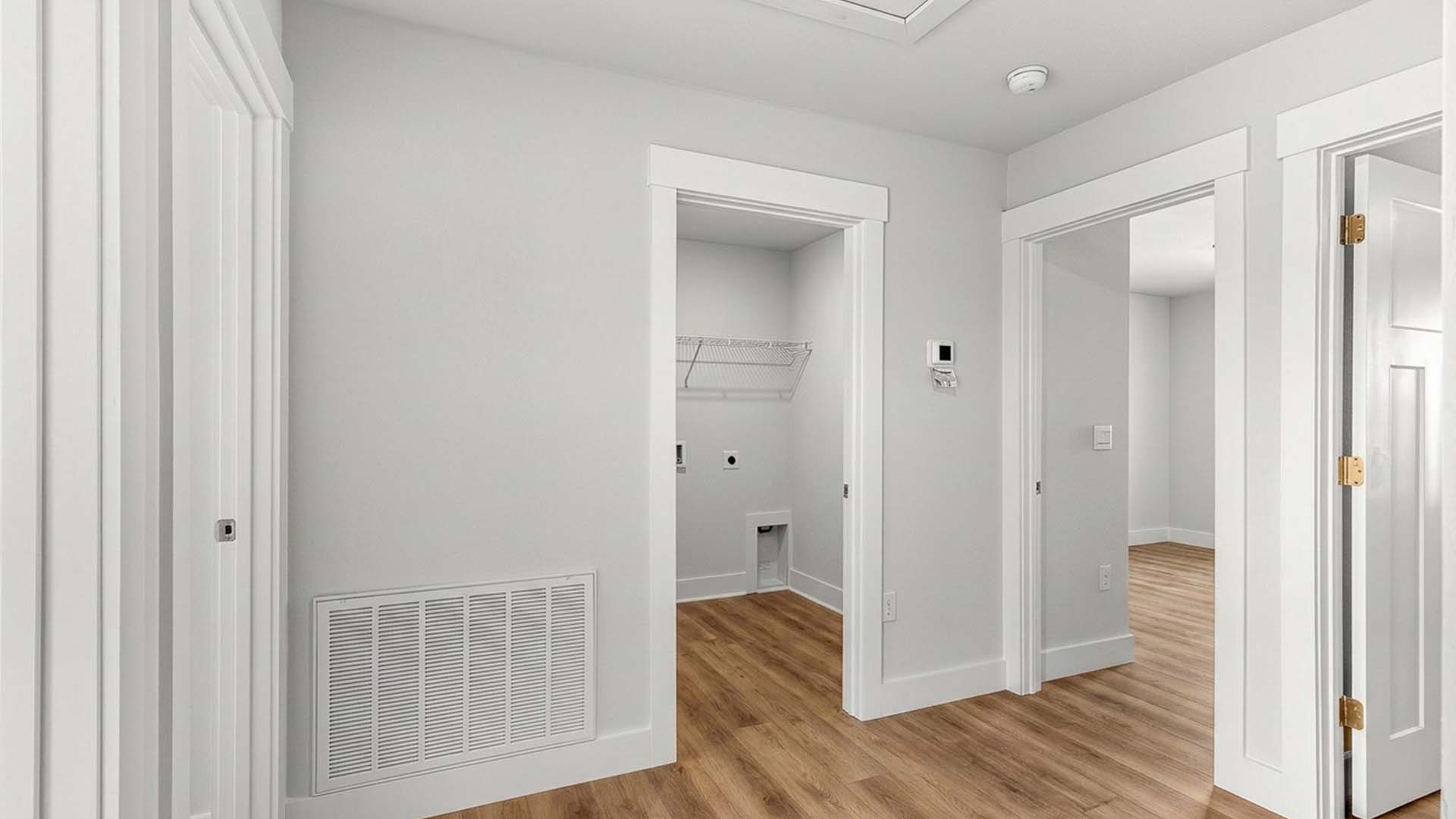 Hall leading to laundry area on second floor has EVP flooring