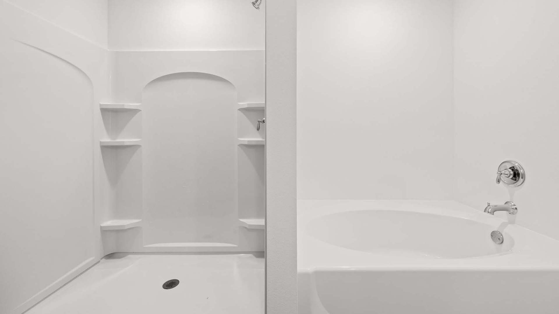The primary bathroom has a shower and separate soak tub
