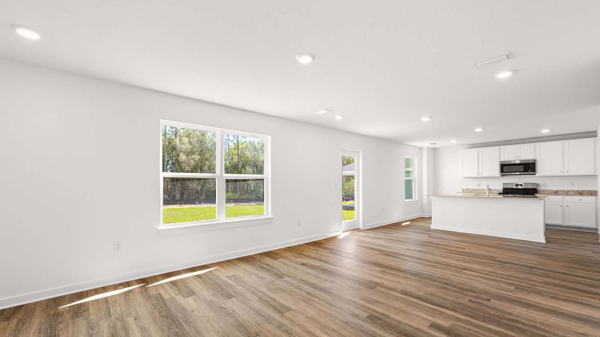 Open concept main level with EVP flooring throughout