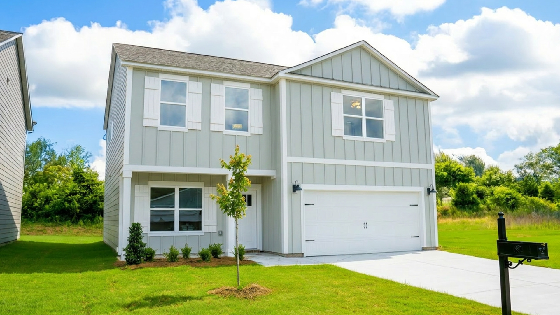 The Princeton at completion has Hardie siding, a two car garage and covered front patio
