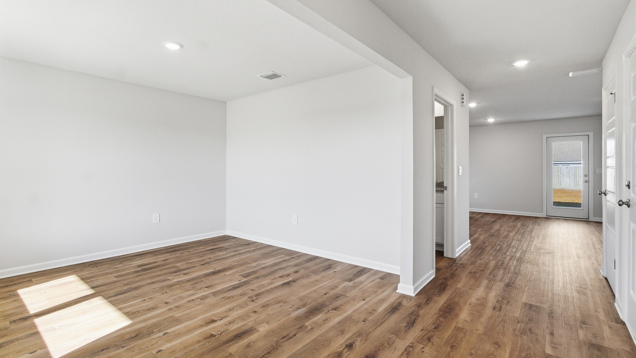 Entering the home you have a flex room just off the entry hall