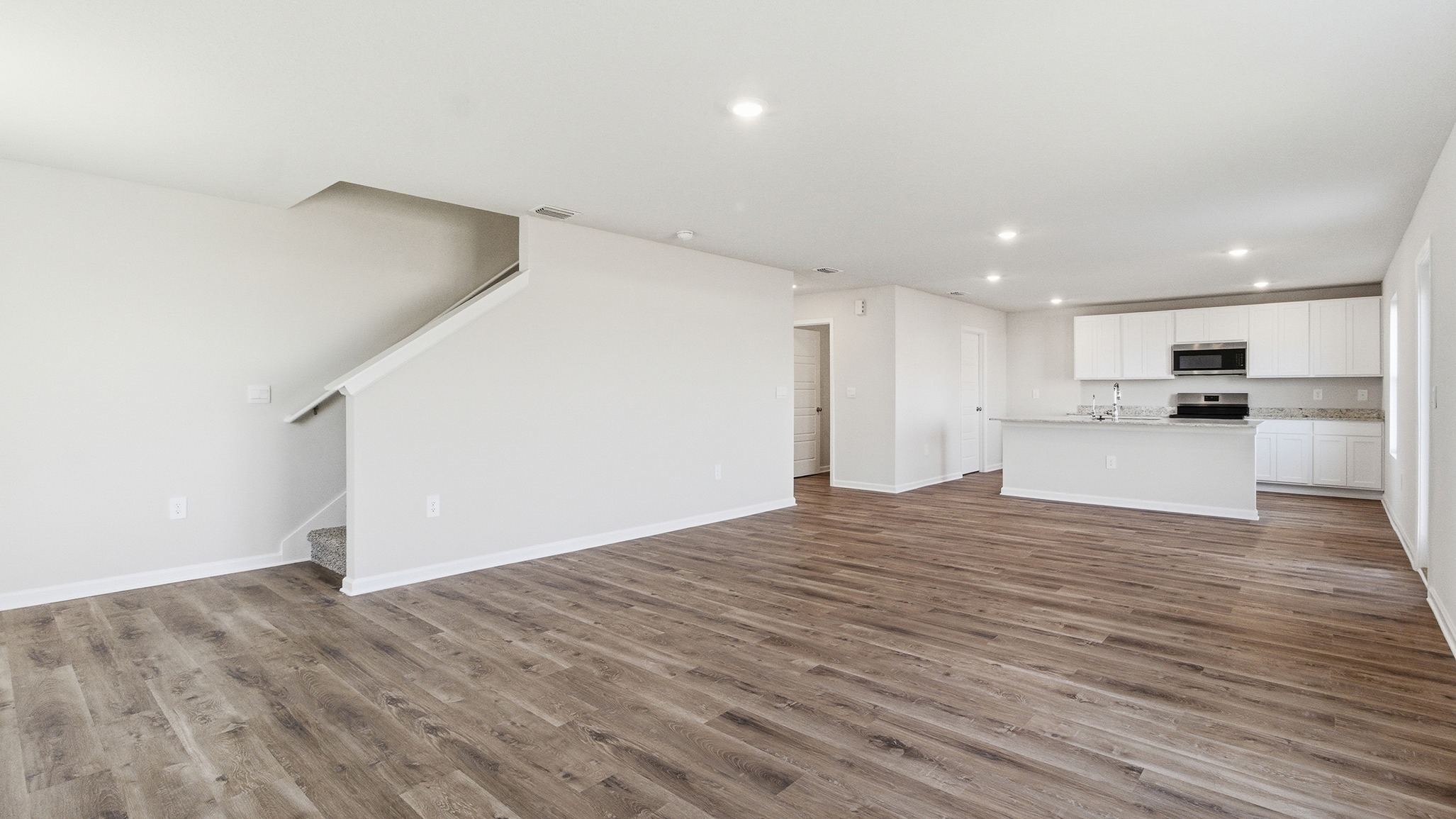 The second level stairs are off the living area